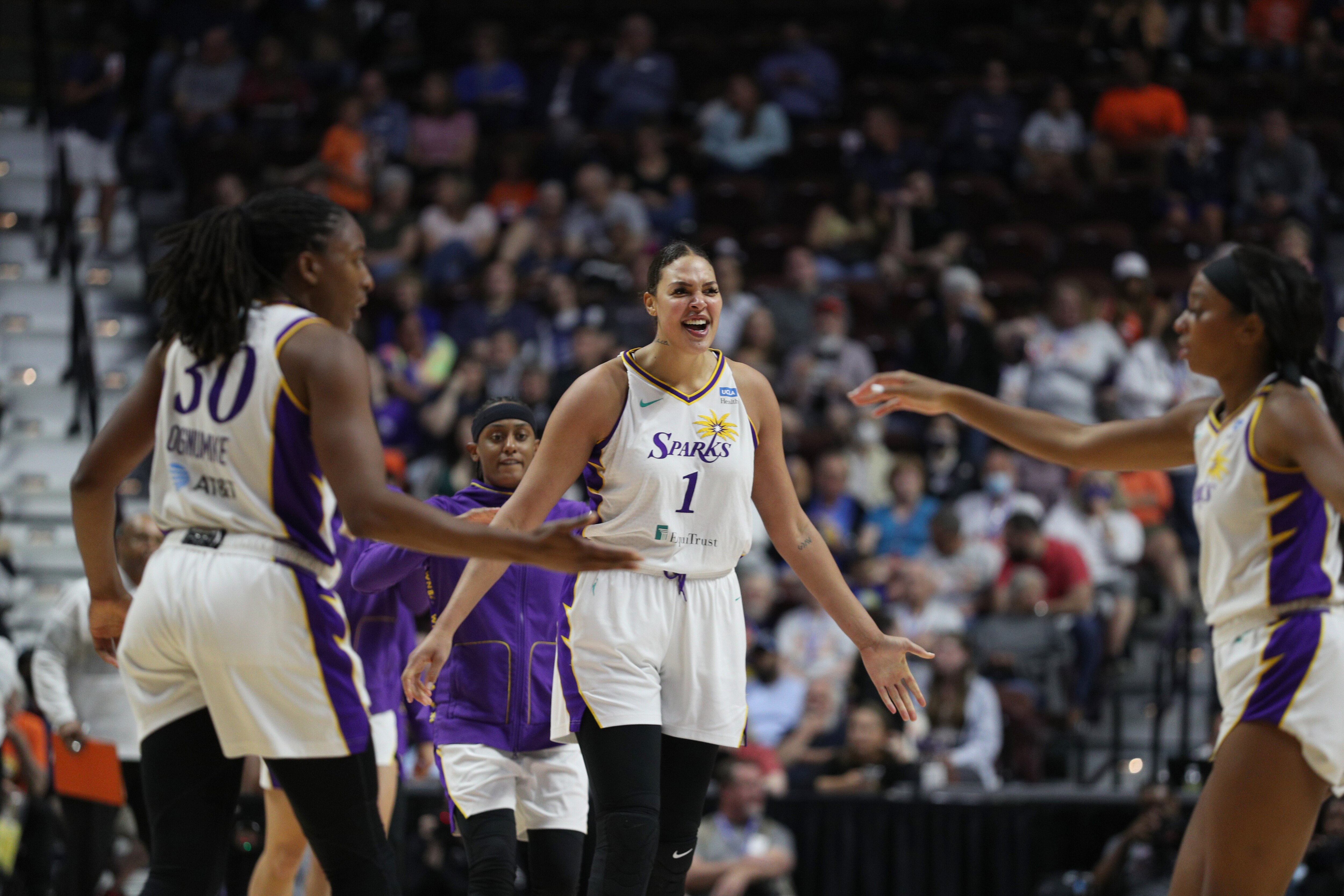 UNCASVILLE, CT -  MAY 14: Liz Cambage #1 of the Los Angeles Sparks celebrates a play during the game against the Connecticut Sun on May 14, 2022 at the Mohegan Sun Arena in Uncasville, Connecticut. NOTE TO USER: User expressly acknowledges and agrees that, by downloading and or using this photograph, User is consenting to the terms and conditions of the Getty Images License Agreement. Mandatory Copyright Notice: Copyright 2022 NBAE (Photo by Chris Marion/NBAE via Getty Images)