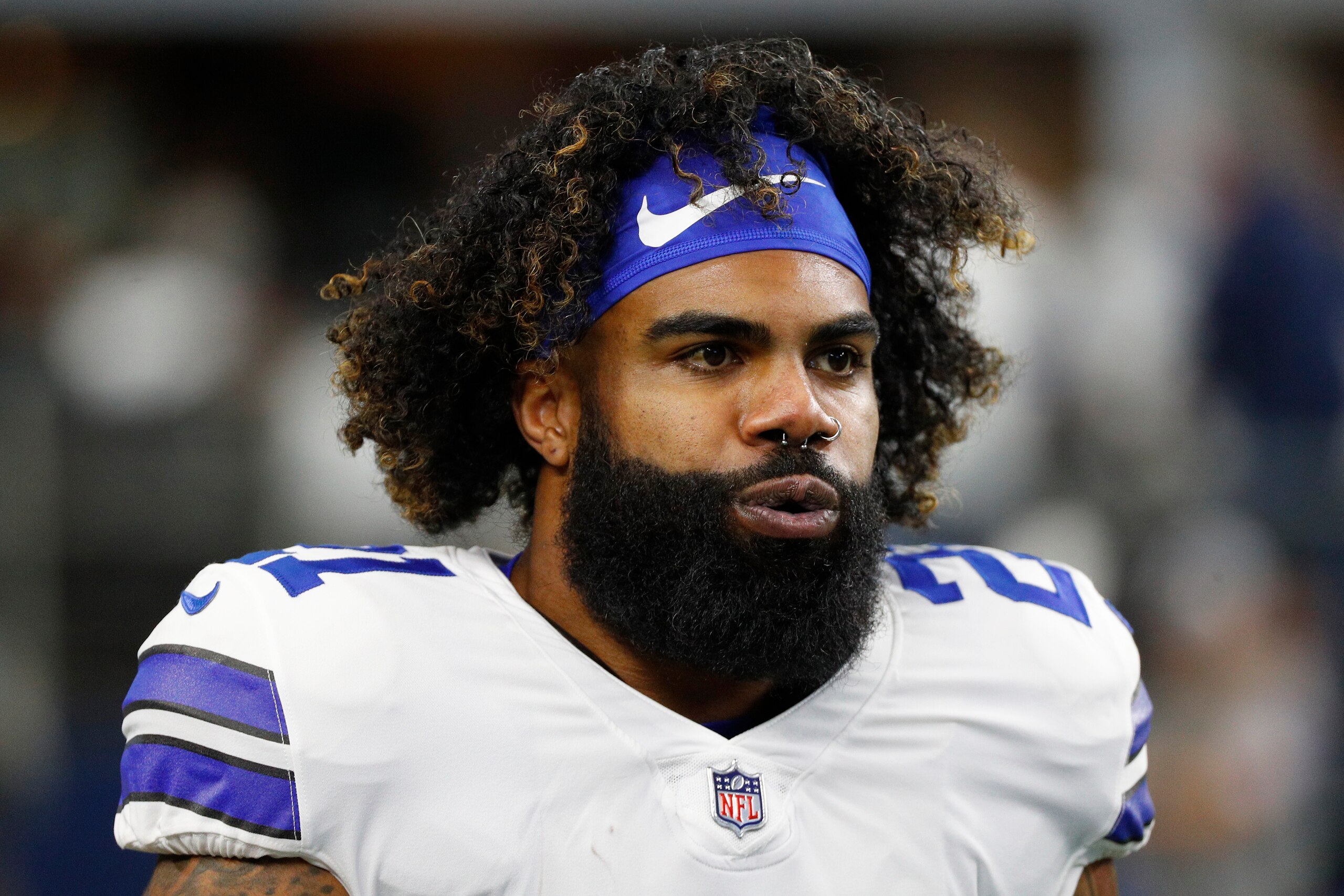 ARLINGTON, TEXAS - JANUARY 16: Ezekiel Elliott #21 of the Dallas Cowboys looks on during pregame warm-ups prior to a game against the San Francisco 49ers in the NFC Wild Card Playoff game at AT&T Stadium on January 16, 2022 in Arlington, Texas. (Photo by Richard Rodriguez/Getty Images)