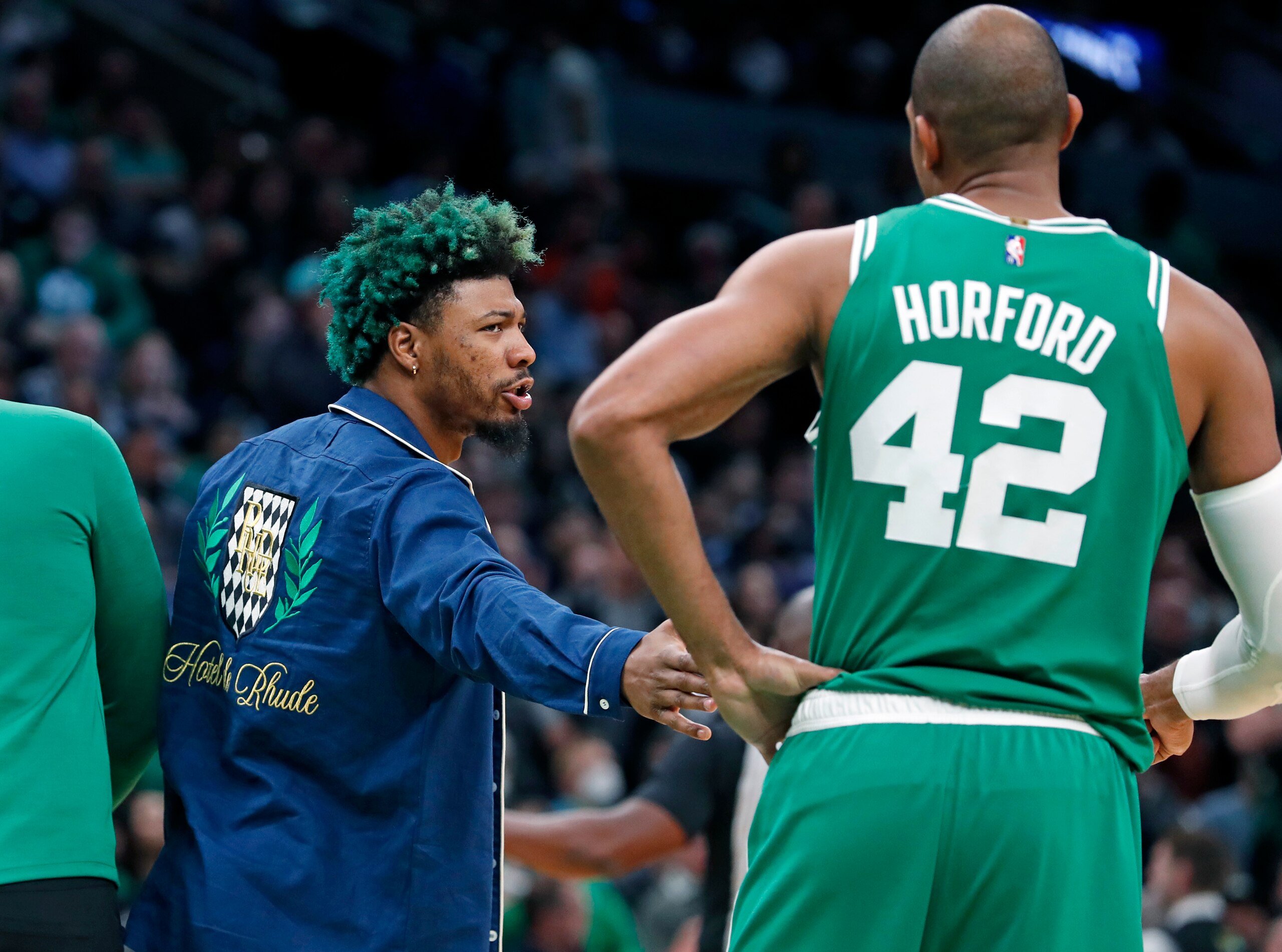 Boston - May 3: The Celtics Marcus Smart (left) has a hand for teammate Al Horford during a second quarter timeout. The Boston Celtics host the Milwaukee Bucks in Game 2 of the Eastern Conference semi-finals between the Celtics and Bucks on May 3, 2022 at TD Garden in Boston. (Photo by Jim Davis/The Boston Globe via Getty Images)