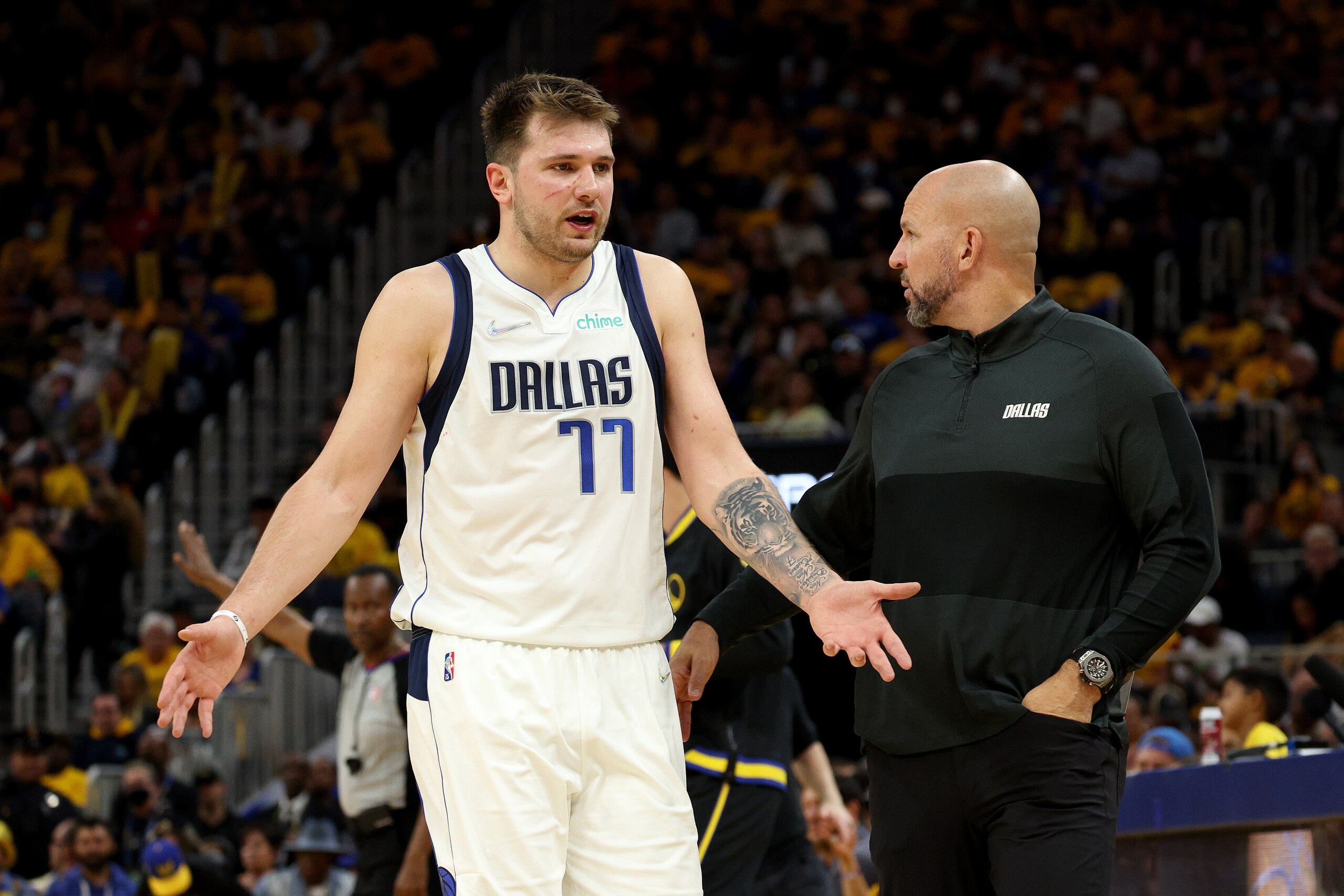 SAN FRANCISCO, CALIFORNIA - MAY 18: Luka Doncic #77 of the Dallas Mavericks reacts as he passes Head Coach Jason Kidd of the Dallas Mavericks against the Golden State Warriors during the third quarter in Game One of the 2022 NBA Playoffs Western Conference Finals at Chase Center on May 18, 2022 in San Francisco, California. NOTE TO USER: User expressly acknowledges and agrees that, by downloading and or using this photograph, User is consenting to the terms and conditions of the Getty Images License Agreement.  (Photo by Harry How/Getty Images)