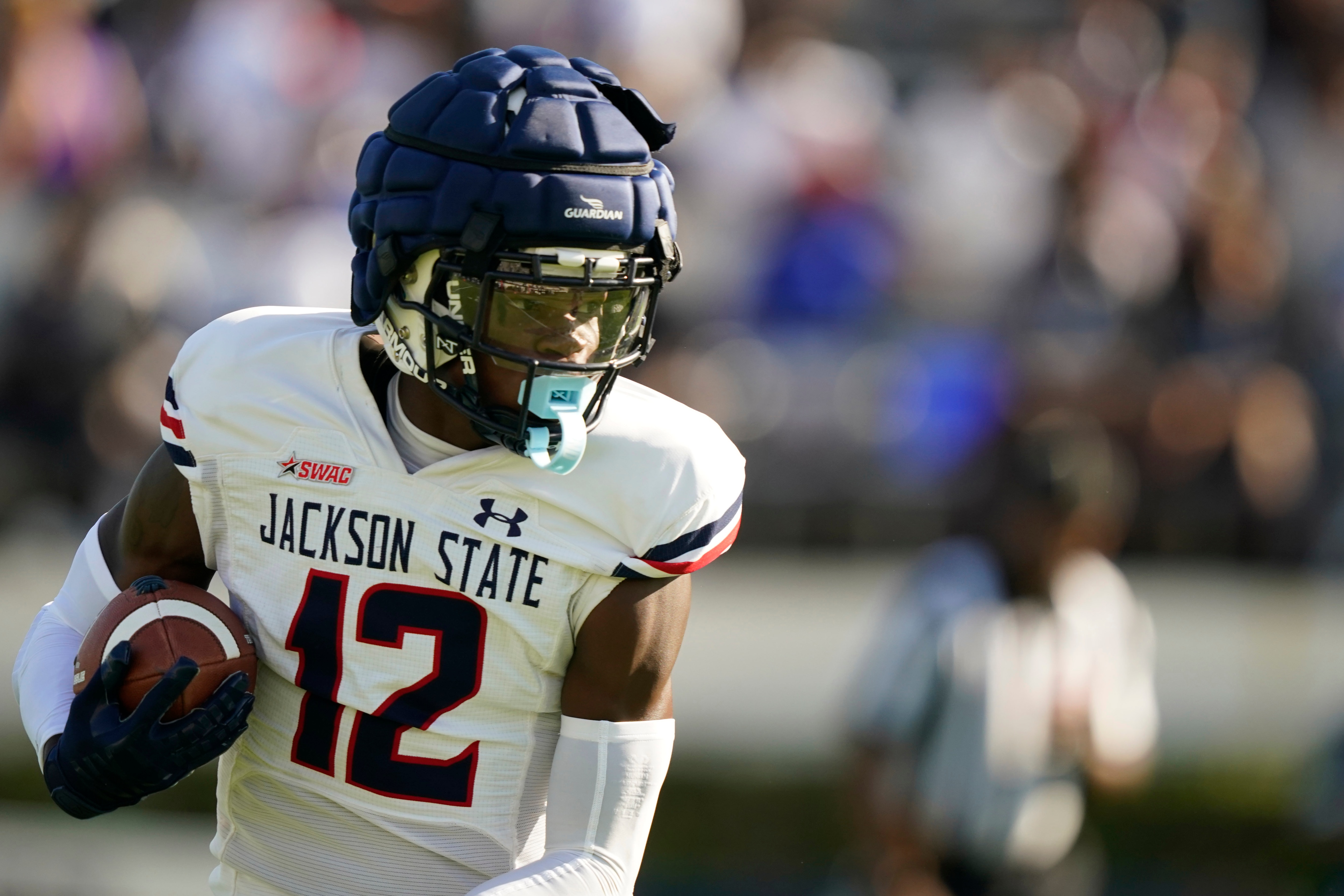 White cornerback Travis Hunter (12) catches a pass in the first half of Jackson State's Blue and White Spring football game, an NCAA college football contest, Sunday, April 24, 2022, in Jackson, Miss. (AP Photo/Rogelio V. Solis)