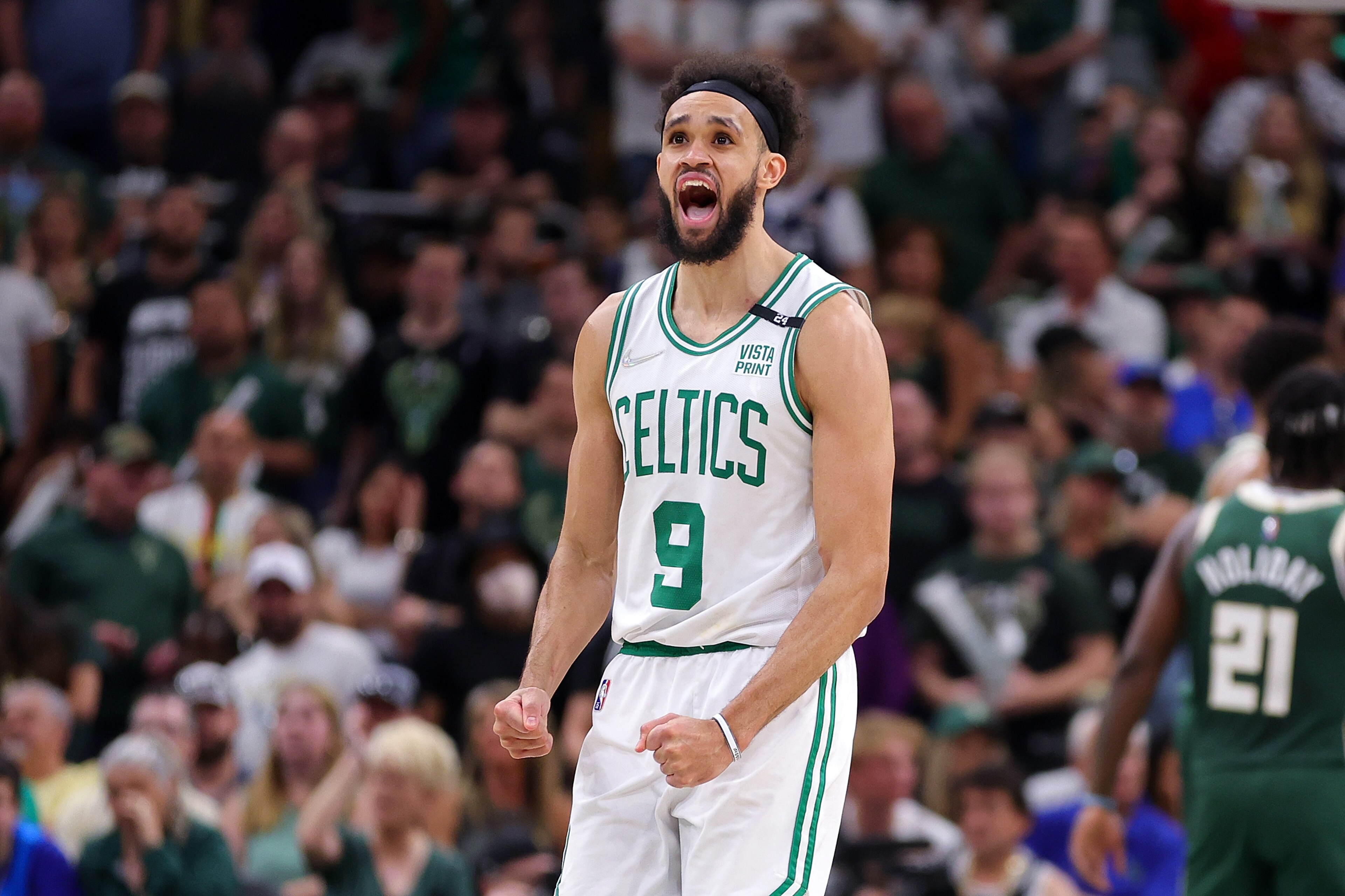 MILWAUKEE, WISCONSIN - MAY 13: Derrick White #9 of the Boston Celtics reacts to a three point shot against the Milwaukee Bucks during the second half of Game Six of the Eastern Conference Semifinals at Fiserv Forum on May 13, 2022 in Milwaukee, Wisconsin. NOTE TO USER: User expressly acknowledges and agrees that, by downloading and or using this photograph, User is consenting to the terms and conditions of the Getty Images License Agreement. (Photo by Stacy Revere/Getty Images)