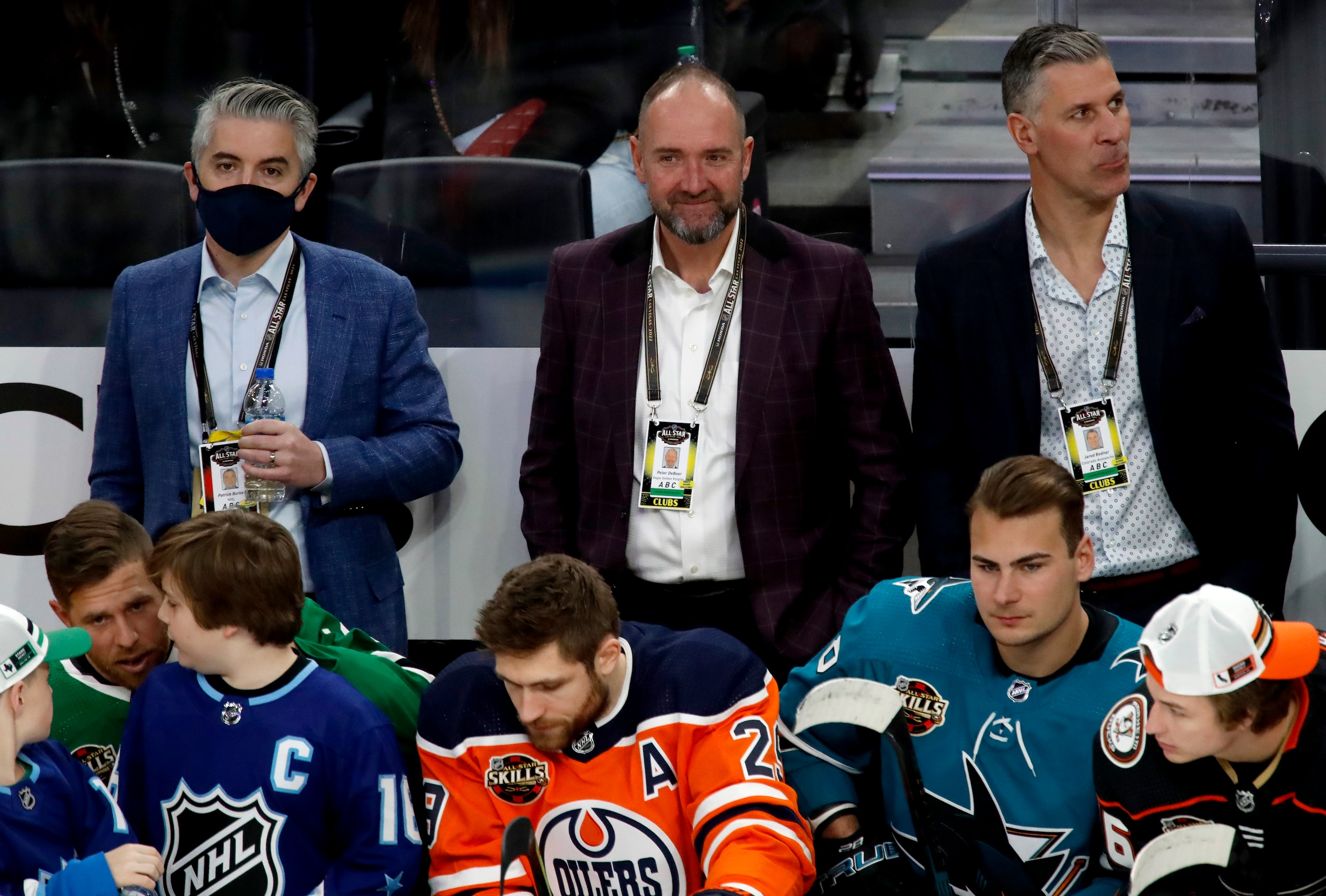 LAS VEGAS, NEVADA - FEBRUARY 04: Head coaches Peter DeBoer of the Vegas Golden Knights (C) and Jared Bednar of the Colorado Avalanche look on from behind the bench during the 2022 NHL All-Star Skills as part of the 2022 NHL All-Star Weekend on February 04, 2022 in Las Vegas, Nevada. (Photo by Eliot J. Schechter/NHLI via Getty Images)