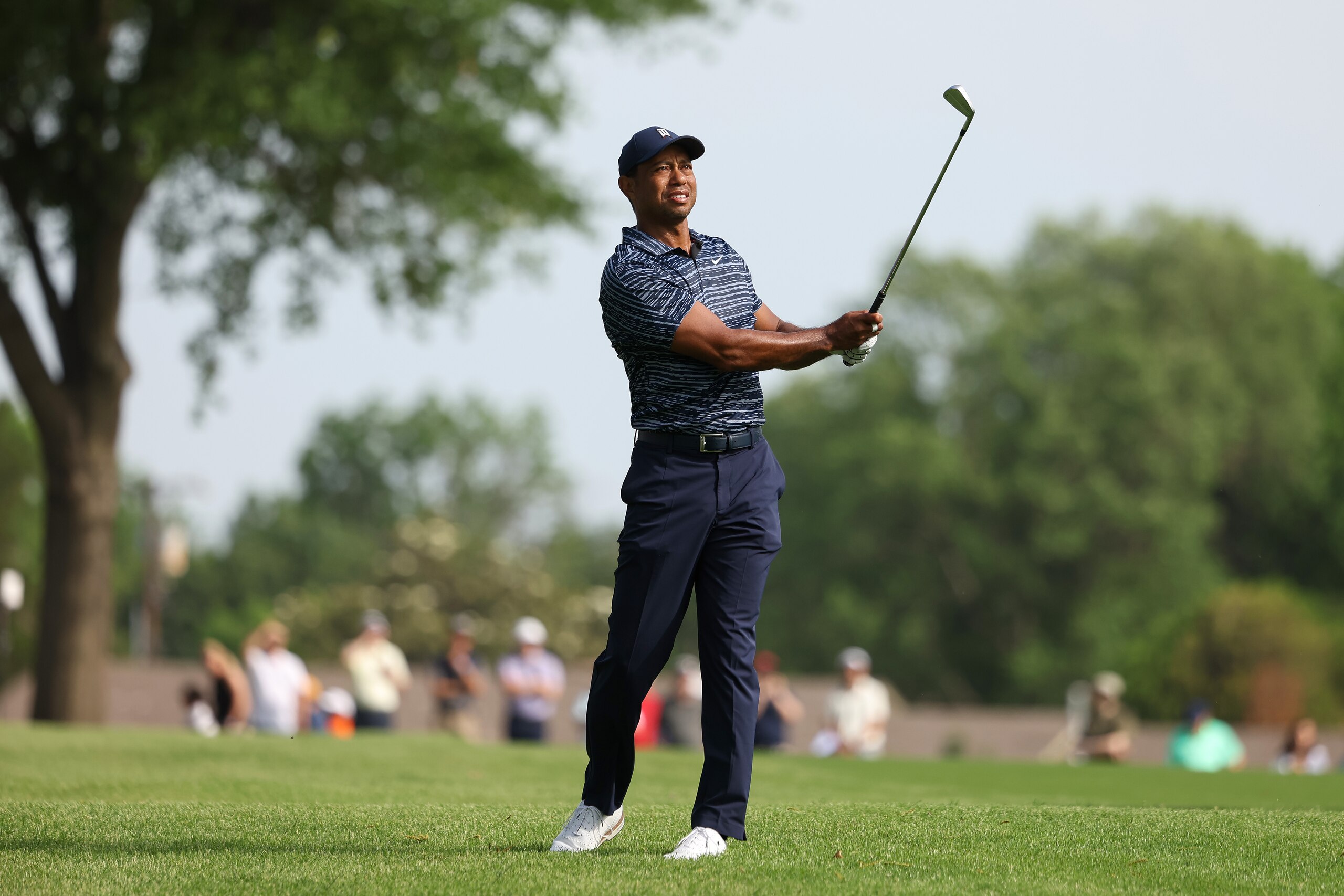TULSA, OKLAHOMA - MAY 19: Tiger Woods of the United States reacts to his shot on the 15th hole during the first round of the 2022 PGA Championship at Southern Hills Country Club on May 19, 2022 in Tulsa, Oklahoma. (Photo by Maddie Meyer/PGA of America/PGA of America via Getty Images )
