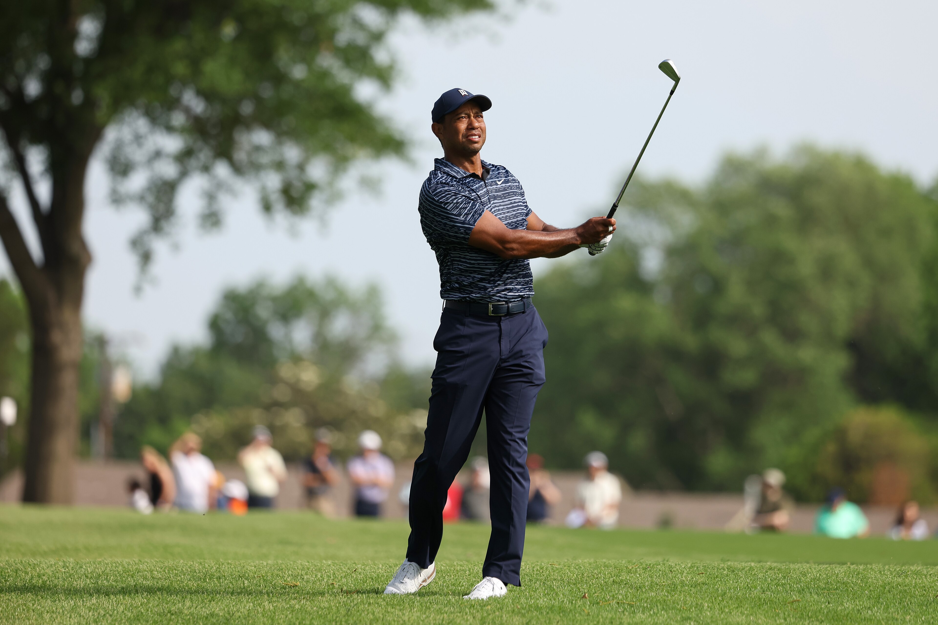 TULSA, OKLAHOMA - MAY 19: Tiger Woods of the United States reacts to his shot on the 15th hole during the first round of the 2022 PGA Championship at Southern Hills Country Club on May 19, 2022 in Tulsa, Oklahoma. (Photo by Maddie Meyer/PGA of America/PGA of America via Getty Images )