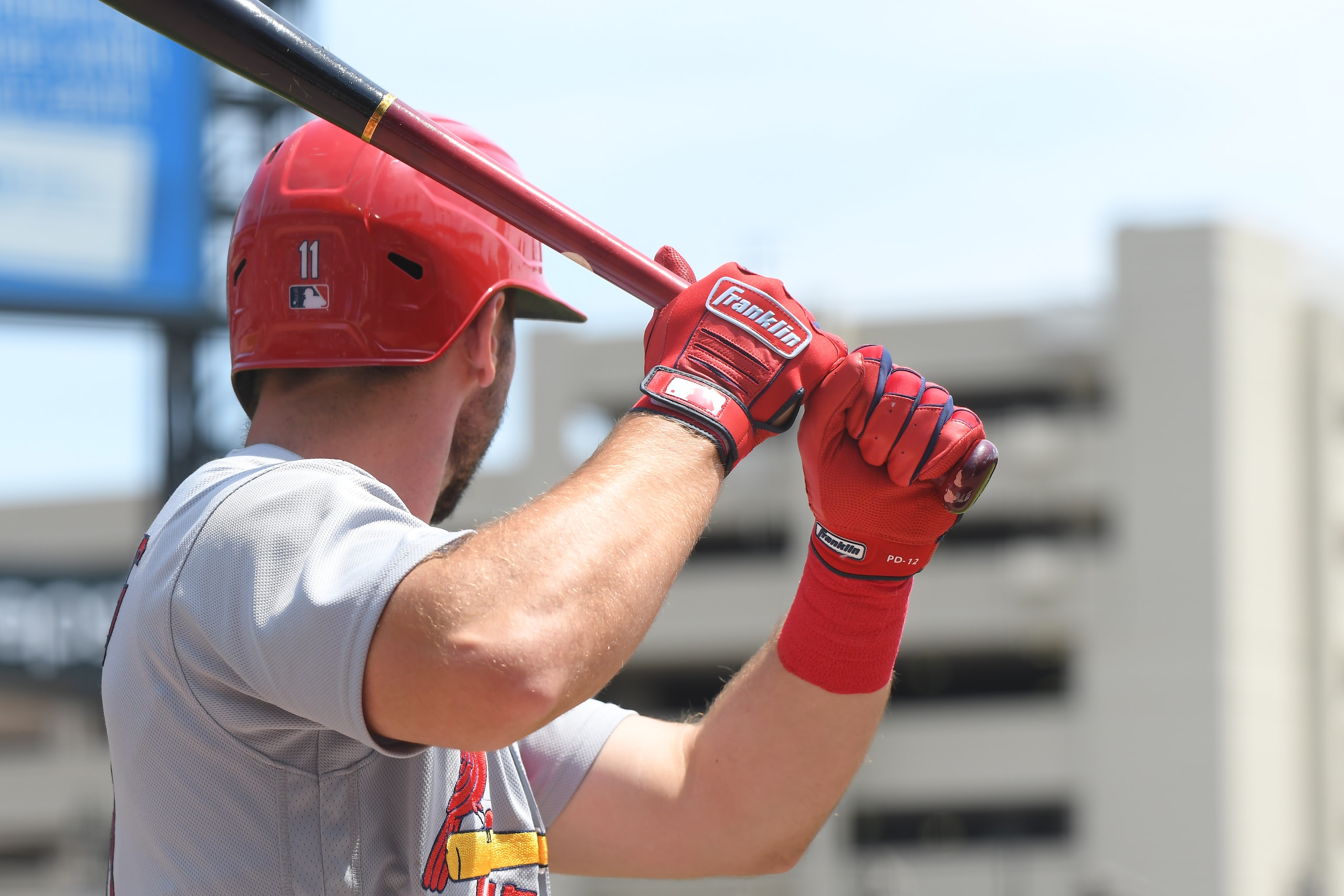 DETROIT, MI - JUNE 23:  A detailed view of the Franklin batting gloves worn by Paul DeJong #11 of the St. Louis Cardinals while he waits on-deck to bat during the game against the Detroit Tigers at Comerica Park on June 23, 2021 in Detroit, Michigan. The Tigers defeated the Cardinals 6-2.  (Photo by Mark Cunningham/MLB Photos via Getty Images)