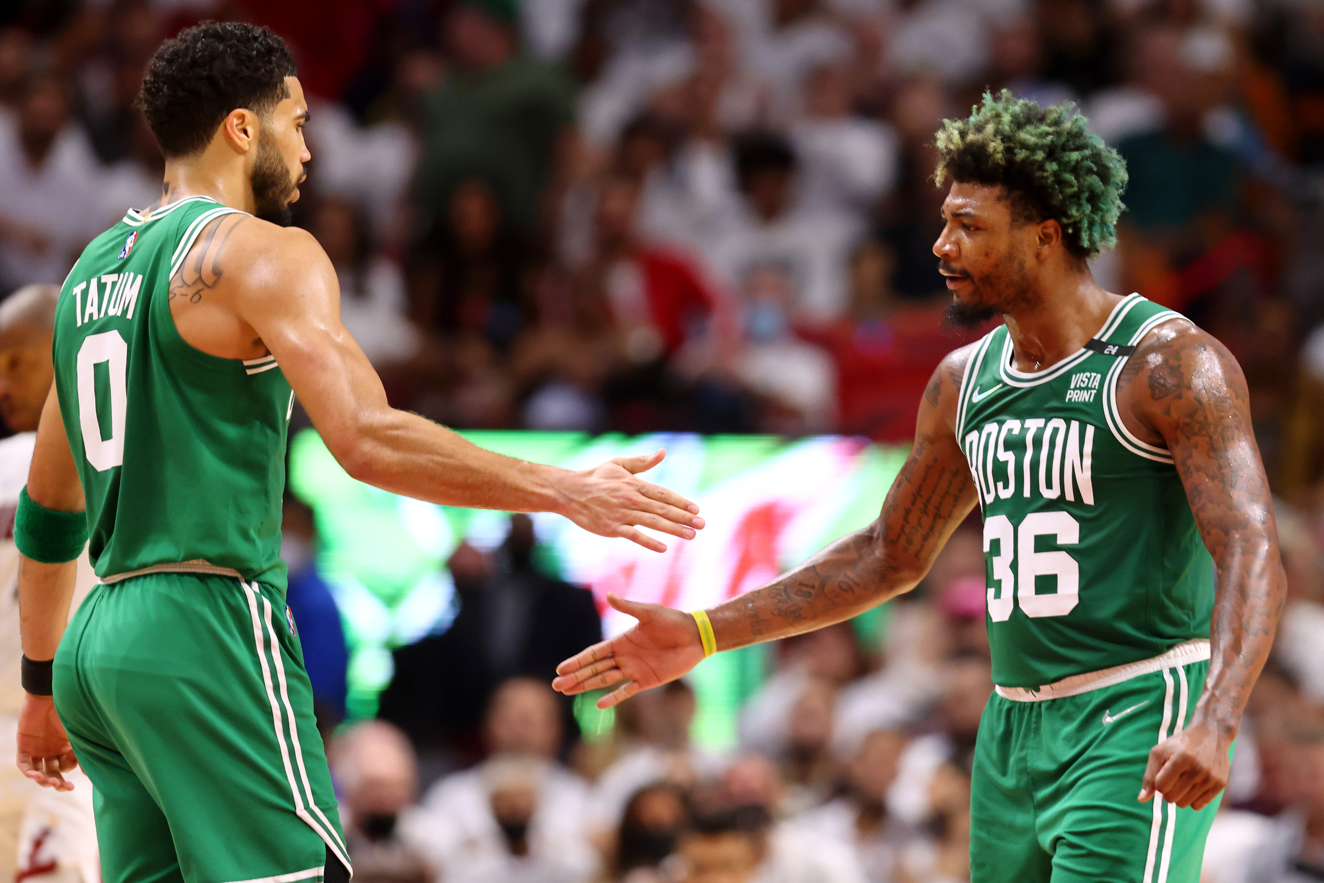 MIAMI, FLORIDA - MAY 19: Jayson Tatum #0 and Marcus Smart #36 of the Boston Celtics high five during the second quarter against the Miami Heat in Game Two of the 2022 NBA Playoffs Eastern Conference Finals at FTX Arena on May 19, 2022 in Miami, Florida. NOTE TO USER: User expressly acknowledges and agrees that, by downloading and or using this photograph, User is consenting to the terms and conditions of the Getty Images License Agreement. (Photo by Michael Reaves/Getty Images)