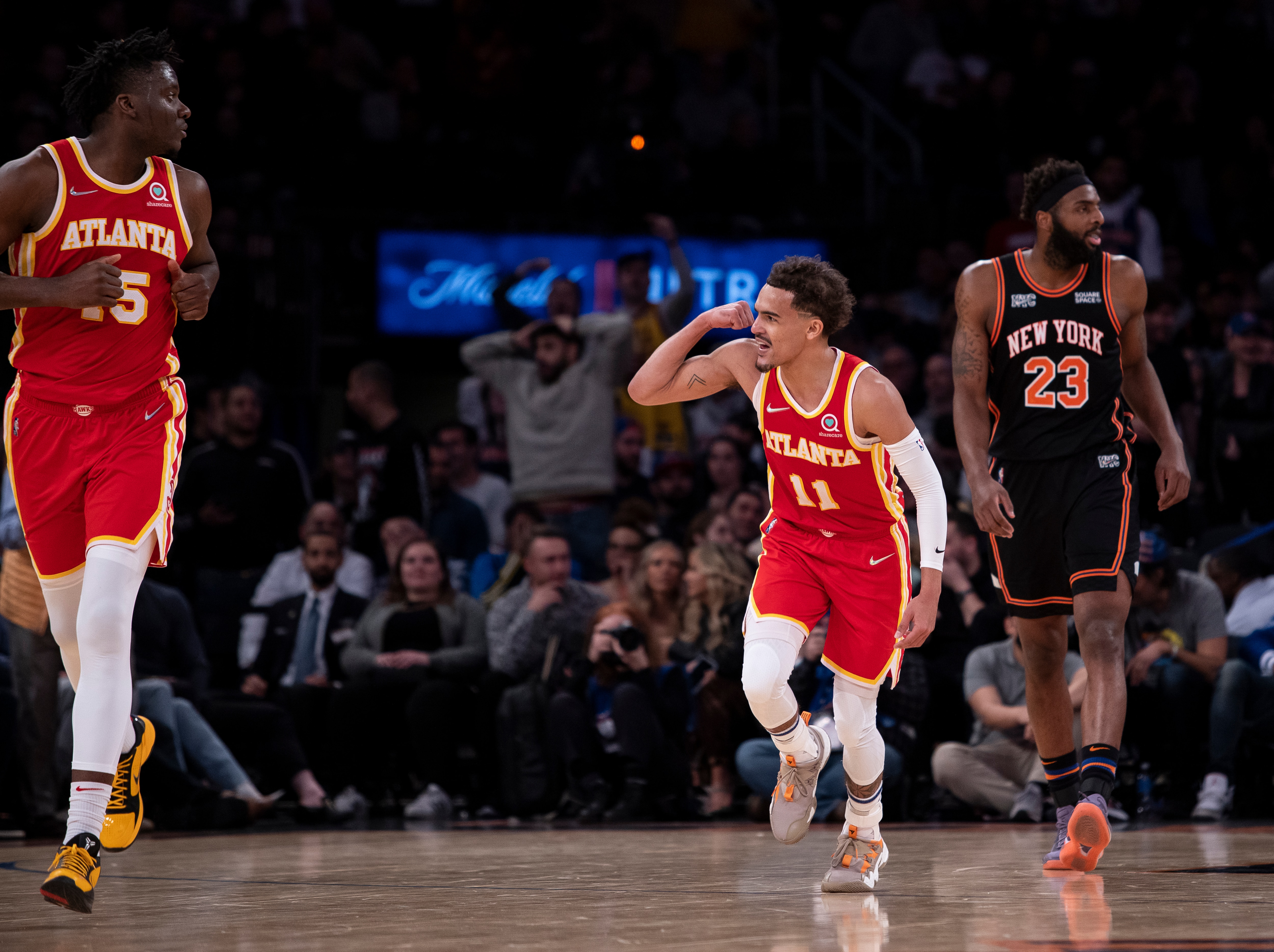 NEW YORK, NEW YORK - MARCH 22: Trae Young #11 of the Atlanta Hawks reacts after a shot against Evan Fournier #13 of the New York Knicks at Madison Square Garden on March 22, 2022 in New York City. NOTE TO USER: User expressly acknowledges and agrees that, by downloading and or using this photograph, User is consenting to the terms and conditions of the Getty Images License Agreement. (Photo by Michelle Farsi/Getty Images)