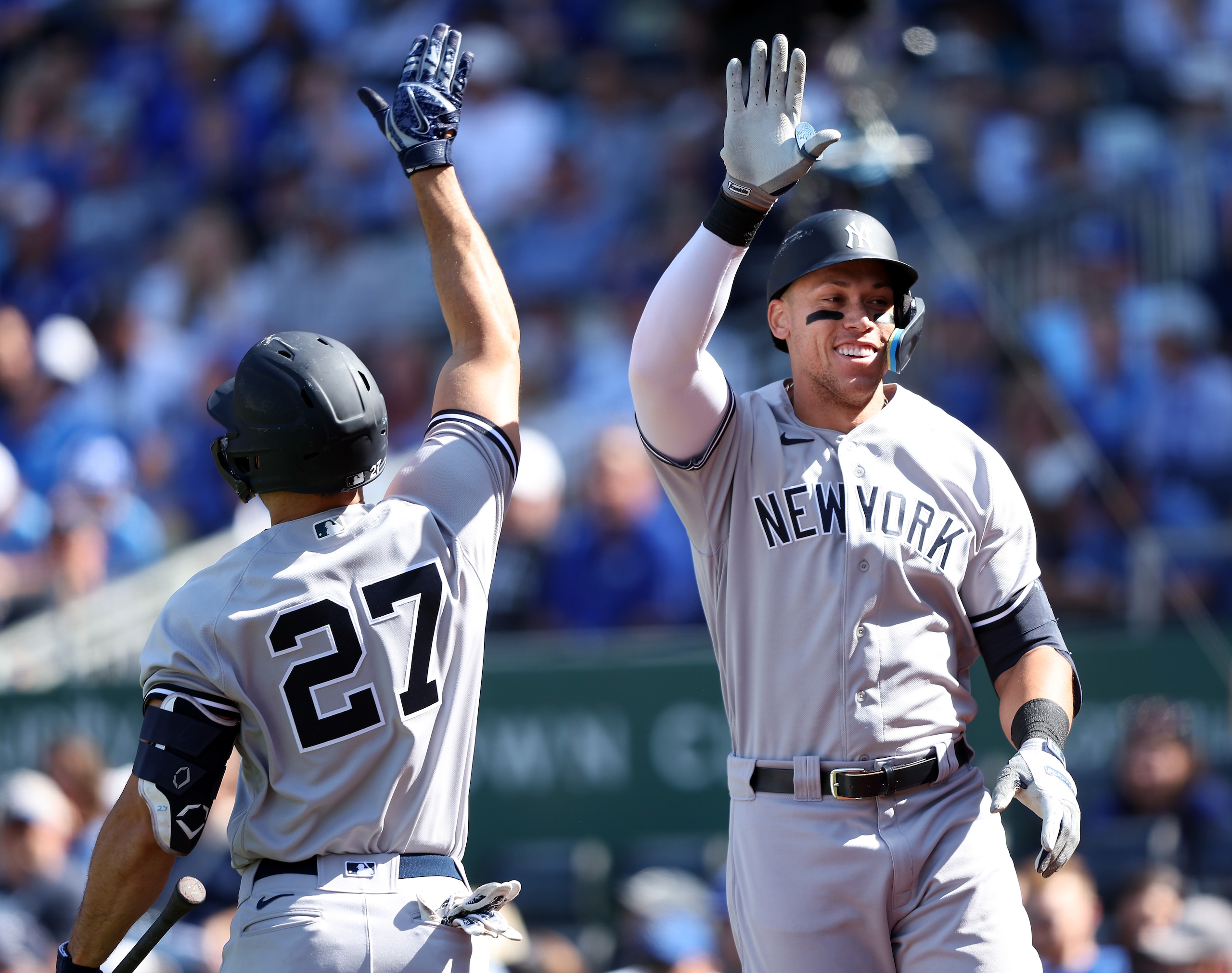 KANSAS CITY, MISSOURI - MAY 01:  Aaron Judge #99 of the New York Yankees is congratulated by Giancarlo Stanton #27 after hitting a solo home run during the 9th inning of the game against the Kansas City Royals at Kauffman Stadium on May 01, 2022 in Kansas City, Missouri. (Photo by Jamie Squire/Getty Images)