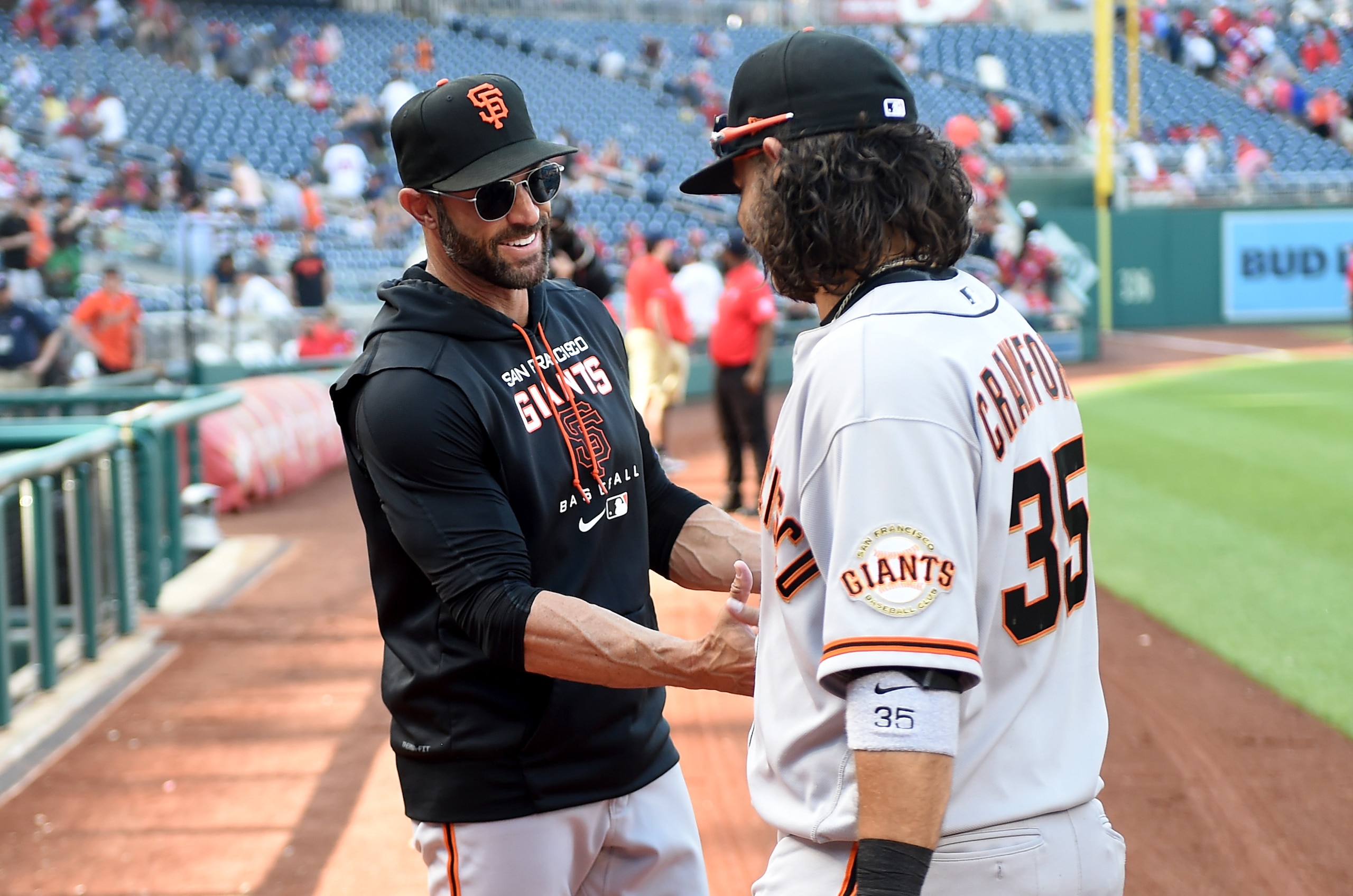WASHINGTON, DC - APRIL 24: Manager Gabe Kapler #19 of the San Francisco Giants celebrates with Brandon Crawford #35 after a 12-3 victory against the Washington Nationals at Nationals Park on April 24, 2022 in Washington, DC. (Photo by Greg Fiume/Getty Images)