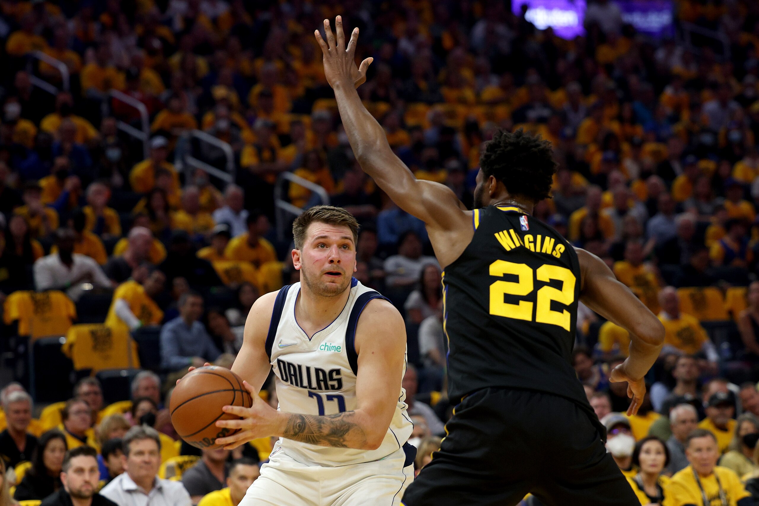 SAN FRANCISCO, CALIFORNIA - MAY 18: Luka Doncic #77 of the Dallas Mavericks looks to shoot against Andrew Wiggins #22 of the Golden State Warriors during the first quarter in Game One of the 2022 NBA Playoffs Western Conference Finals at Chase Center on May 18, 2022 in San Francisco, California. NOTE TO USER: User expressly acknowledges and agrees that, by downloading and or using this photograph, User is consenting to the terms and conditions of the Getty Images License Agreement.  (Photo by Harry How/Getty Images)