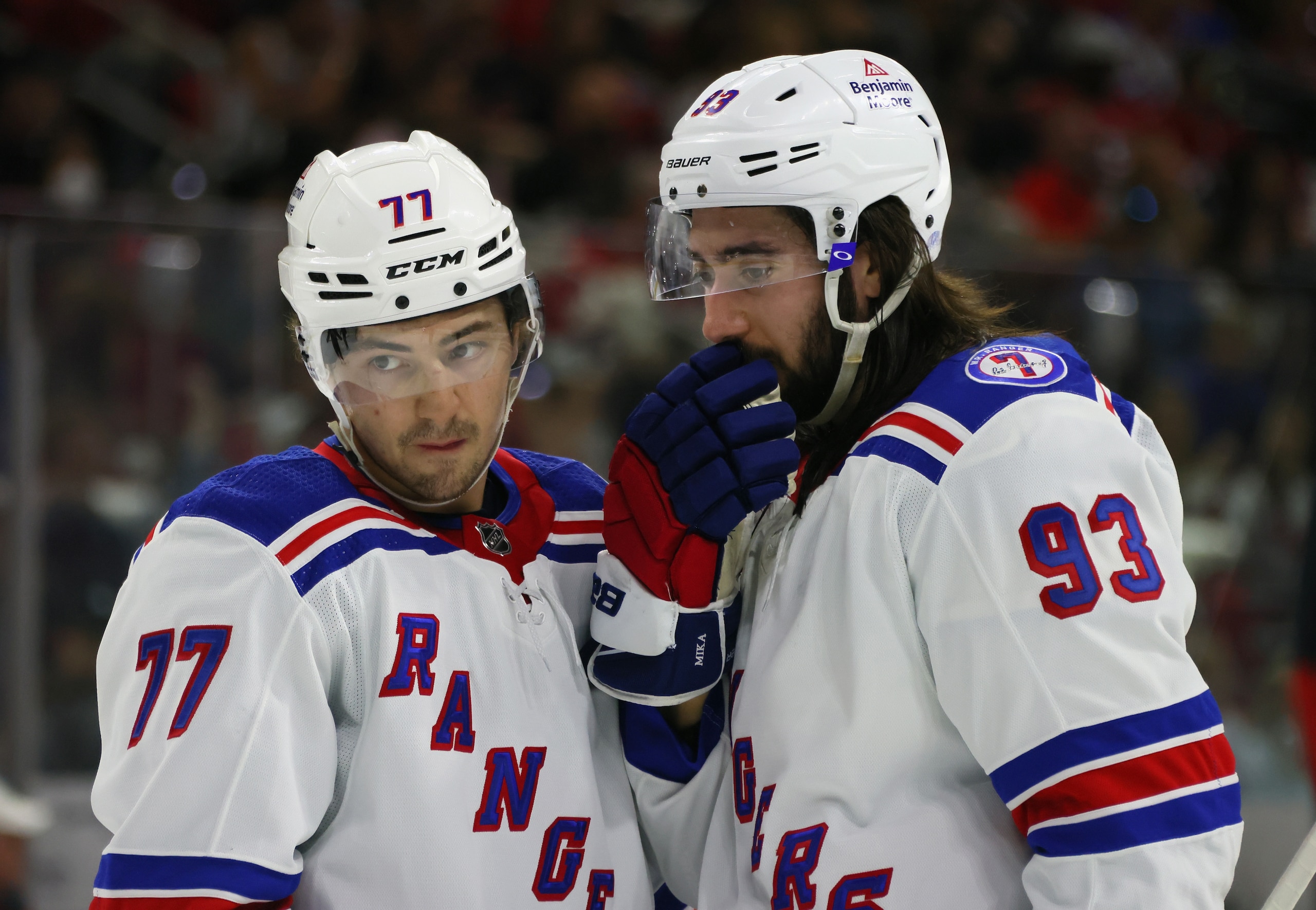 RALEIGH, NORTH CAROLINA - MAY 20: Frank Vatrano #77 and Mika Zibanejad #93 of the New York Rangers confer during the first period in Game Two of the Second Round of the 2022 Stanley Cup Playoffs at PNC Arena on May 20, 2022 in Raleigh, North Carolina. (Photo by Bruce Bennett/Getty Images)