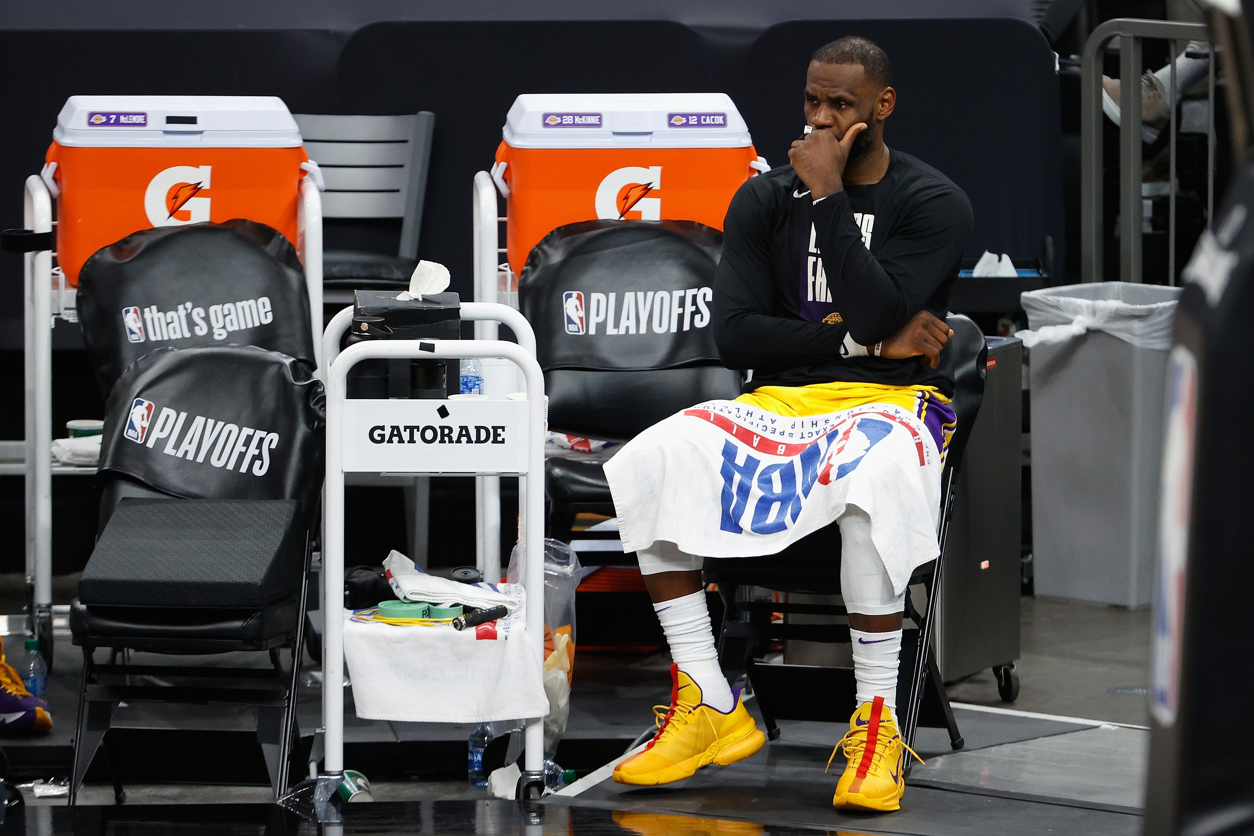 PHOENIX, ARIZONA - JUNE 01:  LeBron James #23 of the Los Angeles Lakers reacts on the bench during the second half in Game Five of the Western Conference first-round playoff series at Phoenix Suns Arena on June 01, 2021 in Phoenix, Arizona. NOTE TO USER: User expressly acknowledges and agrees that, by downloading and or using this photograph, User is consenting to the terms and conditions of the Getty Images License Agreement.  (Photo by Christian Petersen/Getty Images)