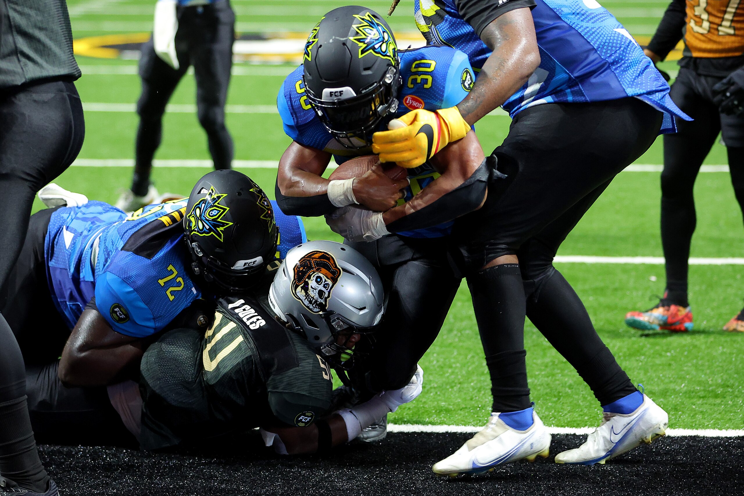 ATLANTA, GEORGIA - MAY 21: Malcolm Ballard #30 of the 8OKI rushes for a touchdown against the Bored Ape FC during the second half during Fan Controlled Football Season v2.0 - Week Six on May 21, 2022 in Atlanta, Georgia. (Photo by Kevin C. Cox/Fan Controlled Football/Getty Images)