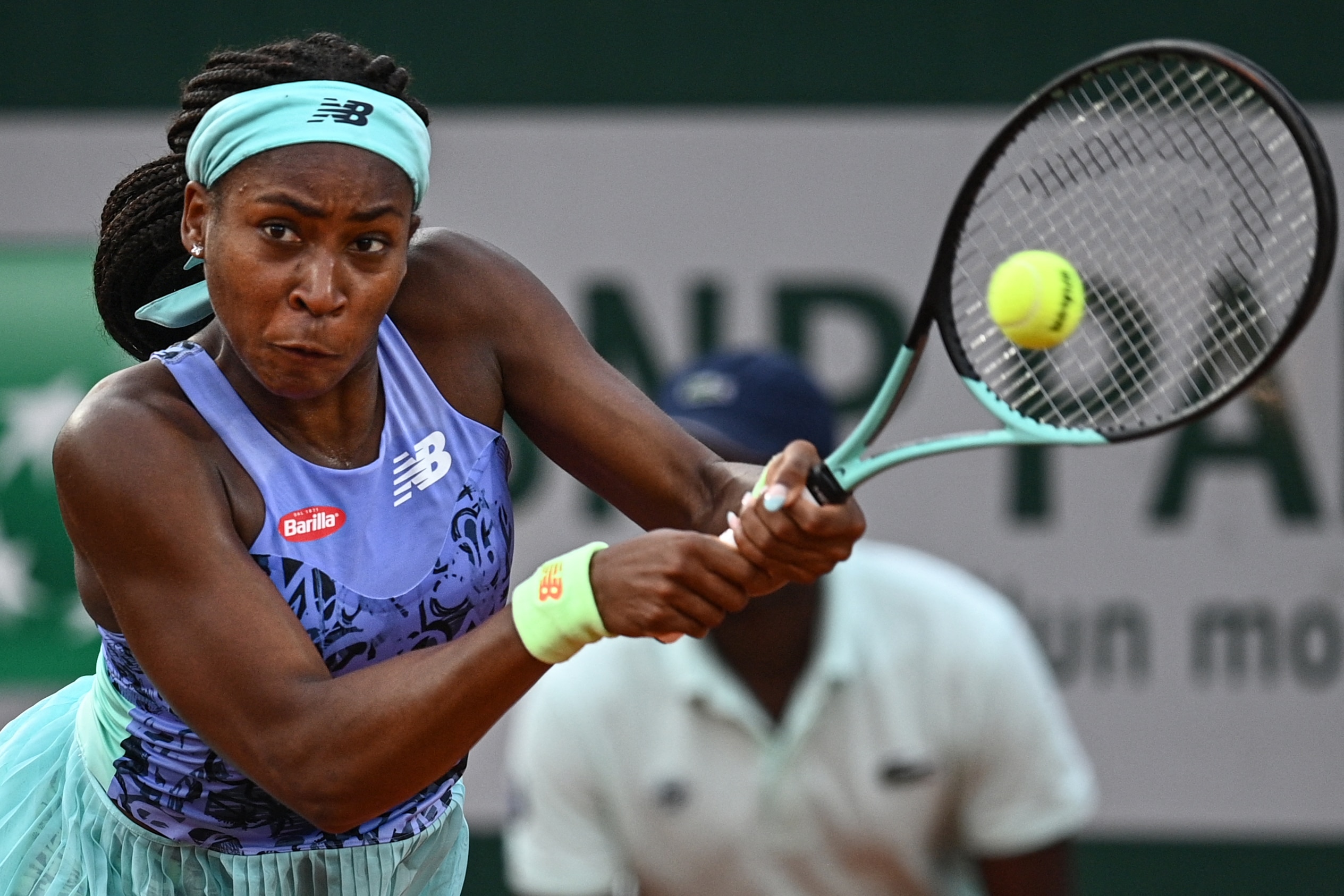 US' Coco Gauff returns the ball to Canada's Rebecca Marino during their women's singles match on day one of the Roland-Garros Open tennis tournament in Paris on May 22, 2022. (Photo by Christophe ARCHAMBAULT / AFP) (Photo by CHRISTOPHE ARCHAMBAULT/AFP via Getty Images)