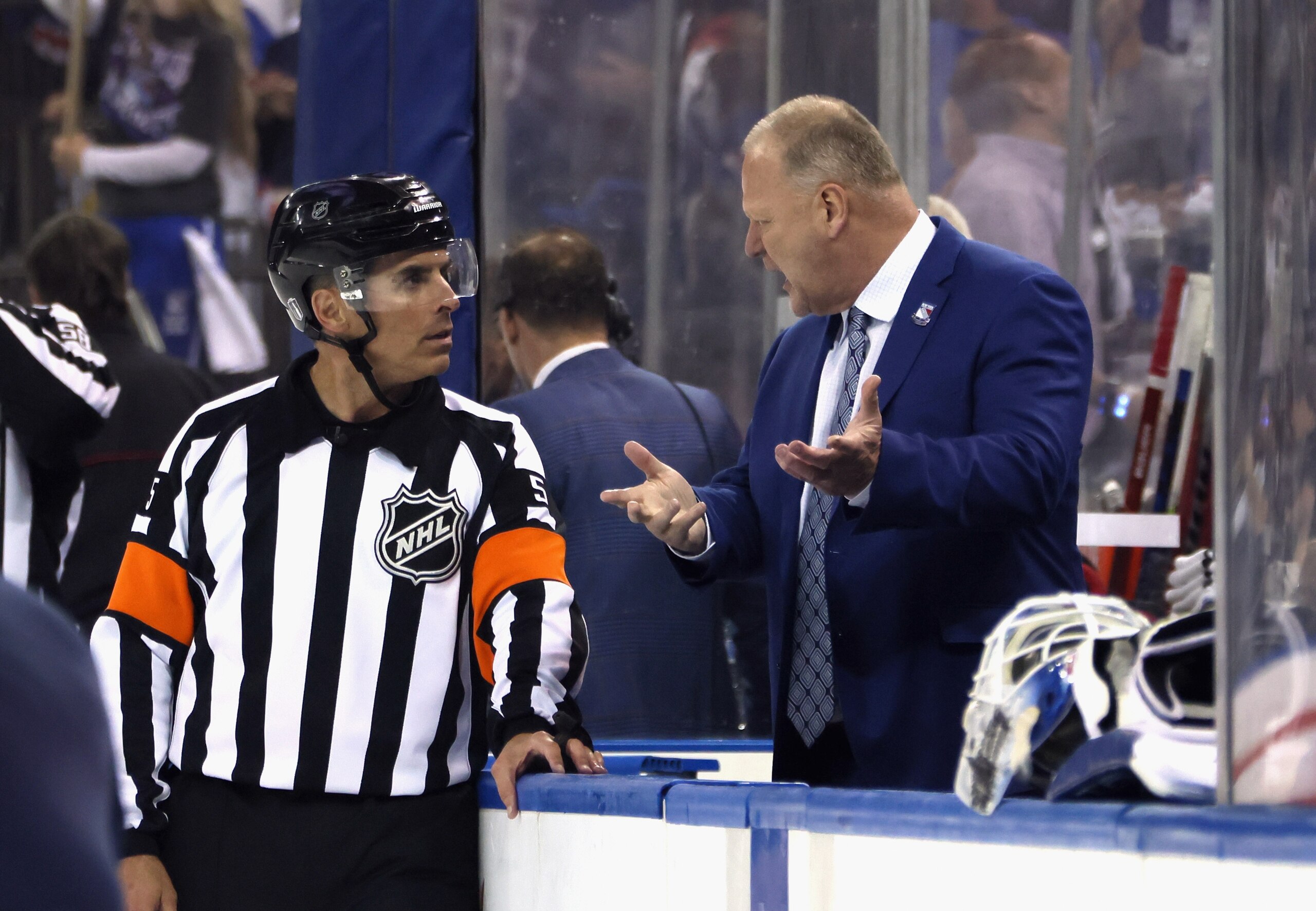 NEW YORK, NEW YORK - MAY 22: Head coach Gerard Gallant of the New York Rangers talks to referee Chris Rooney #5 following a 3-1 victory over the Carolina Hurricanes in Game Three of the Second Round of the 2022 Stanley Cup Playoffs at Madison Square Garden on May 22, 2022 in New York City. (Photo by Bruce Bennett/Getty Images) NEW YORK, NEW YORK - MAY 22: Head coach Gerard Gallant of the New York Rangers talks to referee Chris Rooney #5 following a 3-1 victory over the Carolina Hurricanes in Game Three of the Second Round of the 2022 Stanley Cup Playoffs at Madison Square Garden on May 22, 2022 in New York City. (Photo by Bruce Bennett/Getty Images)