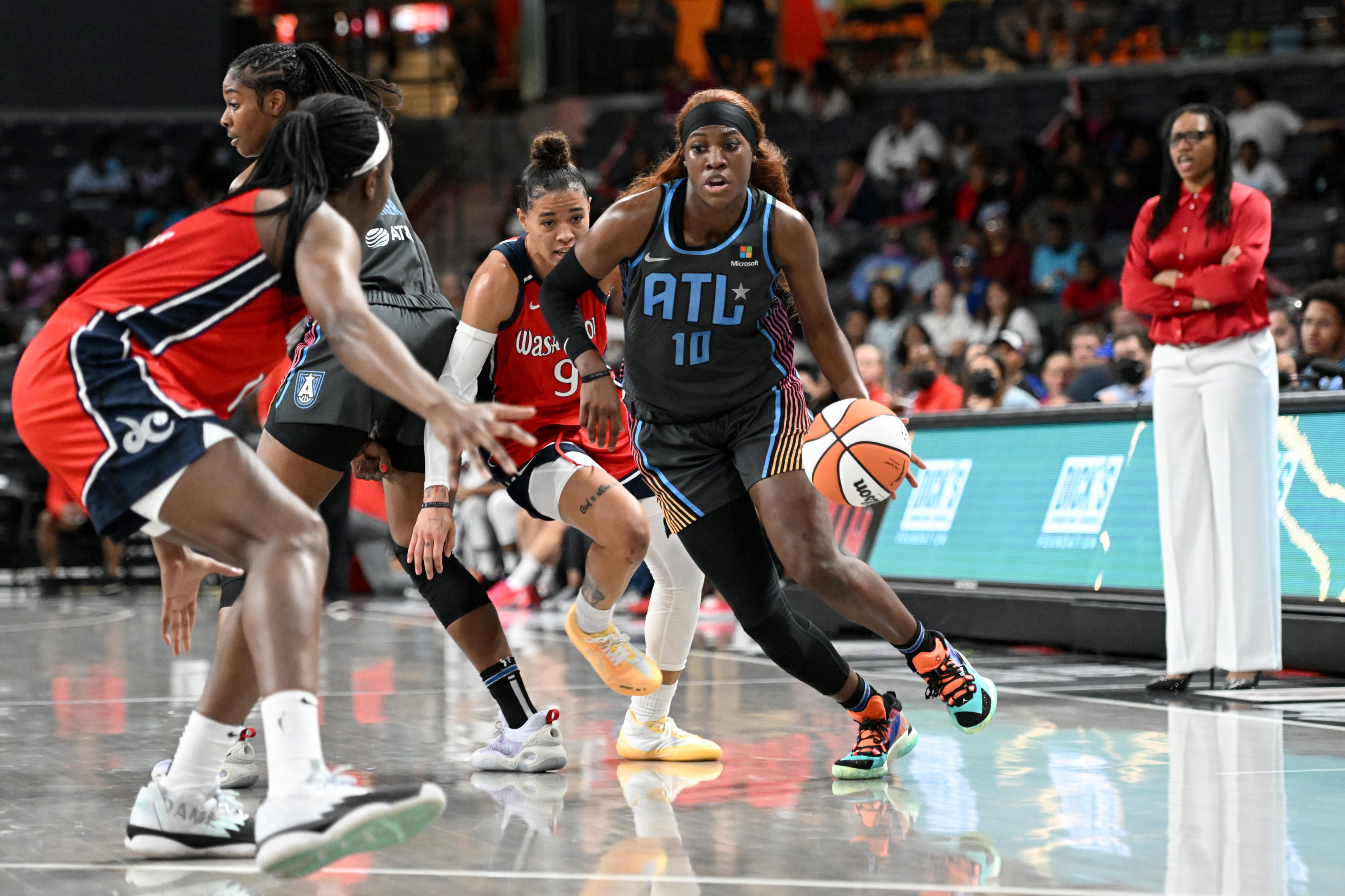 ATLANTA, GA - MAY 20: Rhyne Howard #10 of the Atlanta Dream moves the ball during the game against the Washington Mystics on May 20, 2022 at Gateway Center Arena in Atlanta, Georgia.  NOTE TO USER: User expressly acknowledges and agrees that, by downloading and/or using this Photograph, user is consenting to the terms and conditions of the Getty Images License Agreement. Mandatory Copyright Notice: Copyright 2022 NBAE (Photo by Adam Hagy/NBAE via Getty Images)