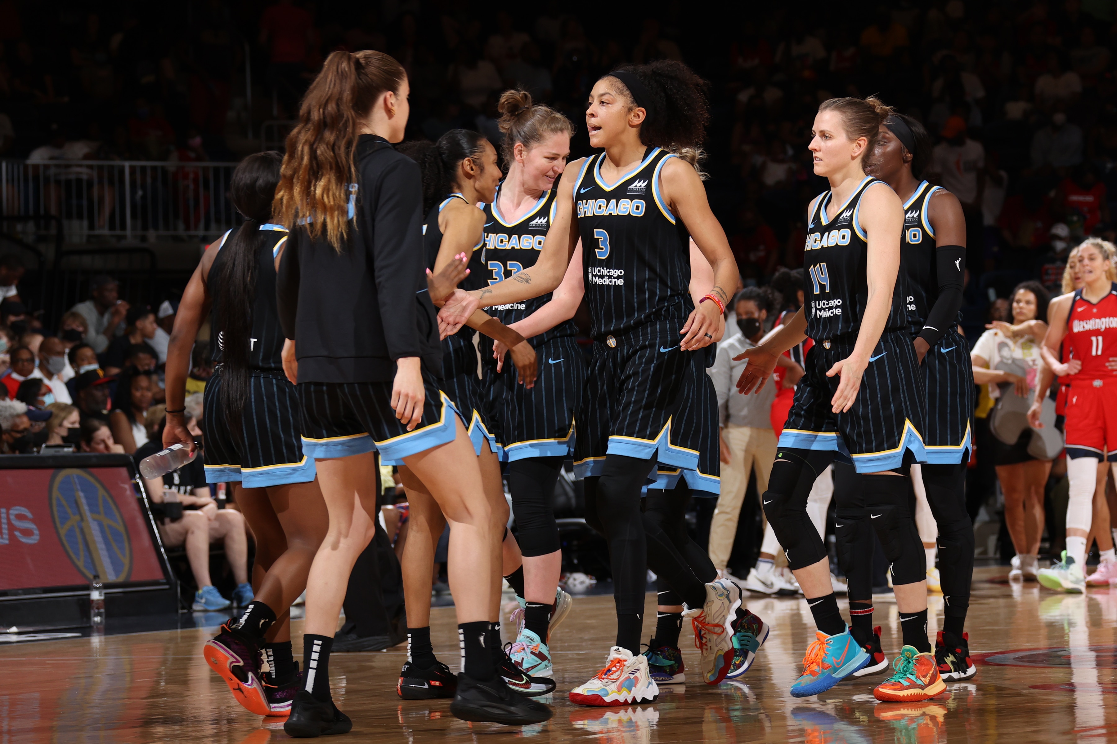 WASHINGTON, DC -MAY 22:  Chicago Sky high fives during time out against the Washington Mystics on May  22, 2022 at Capital One Arena in Washington, DC. NOTE TO USER: User expressly acknowledges and agrees that, by downloading and or using this Photograph, user is consenting to the terms and conditions of the Getty Images License Agreement. Mandatory Copyright Notice: Copyright 2022 NBAE (Photo by Stephen Gosling/NBAE via Getty Images)