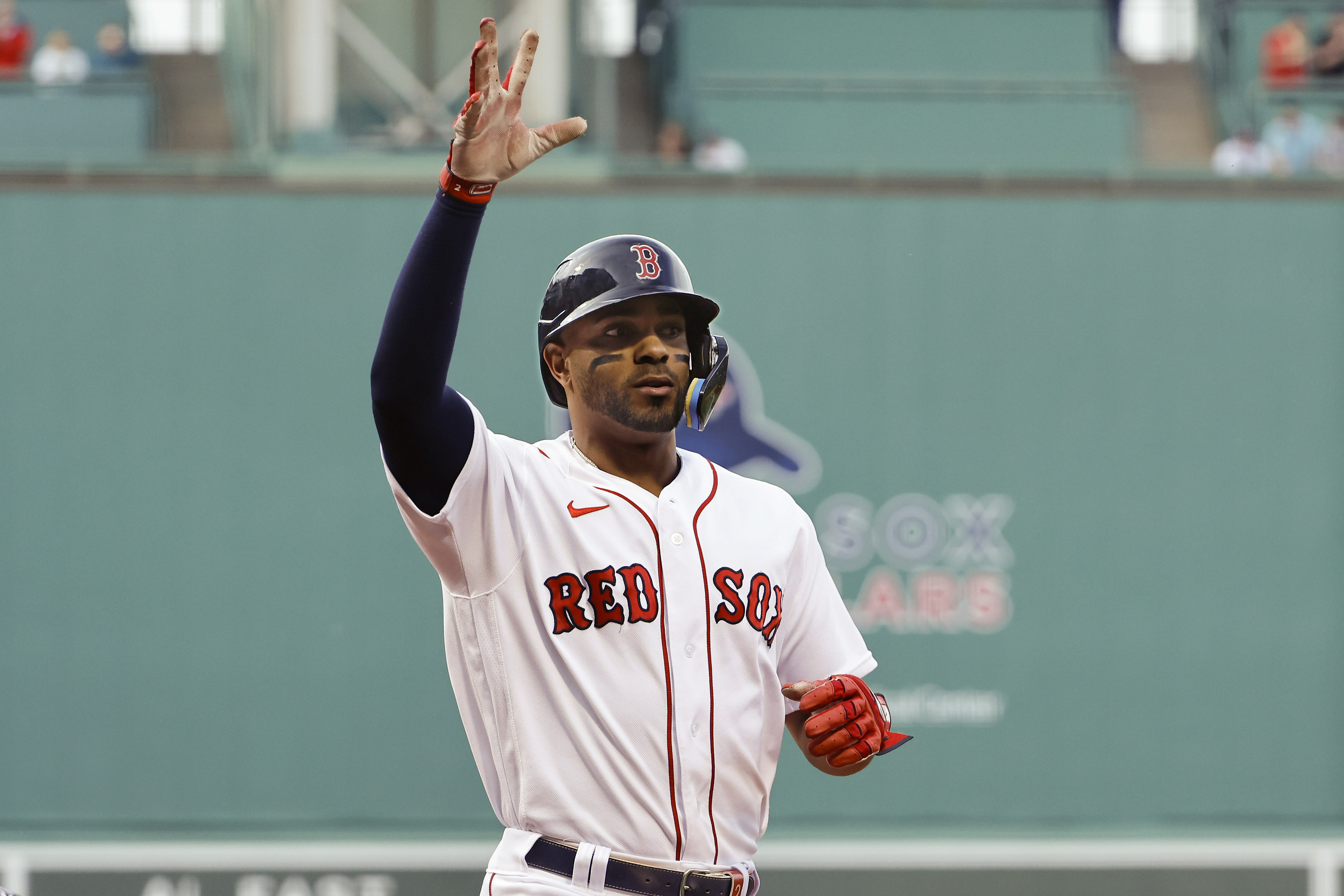 BOSTON, MA - MAY 18: Xander Bogaerts #2 of the Boston Red Sox waves to the crowd after this home run against the Houston Astros during the first inning at Fenway Park on May 18, 2022 in Boston, Massachusetts. (Photo By Winslow Townson/Getty Images)