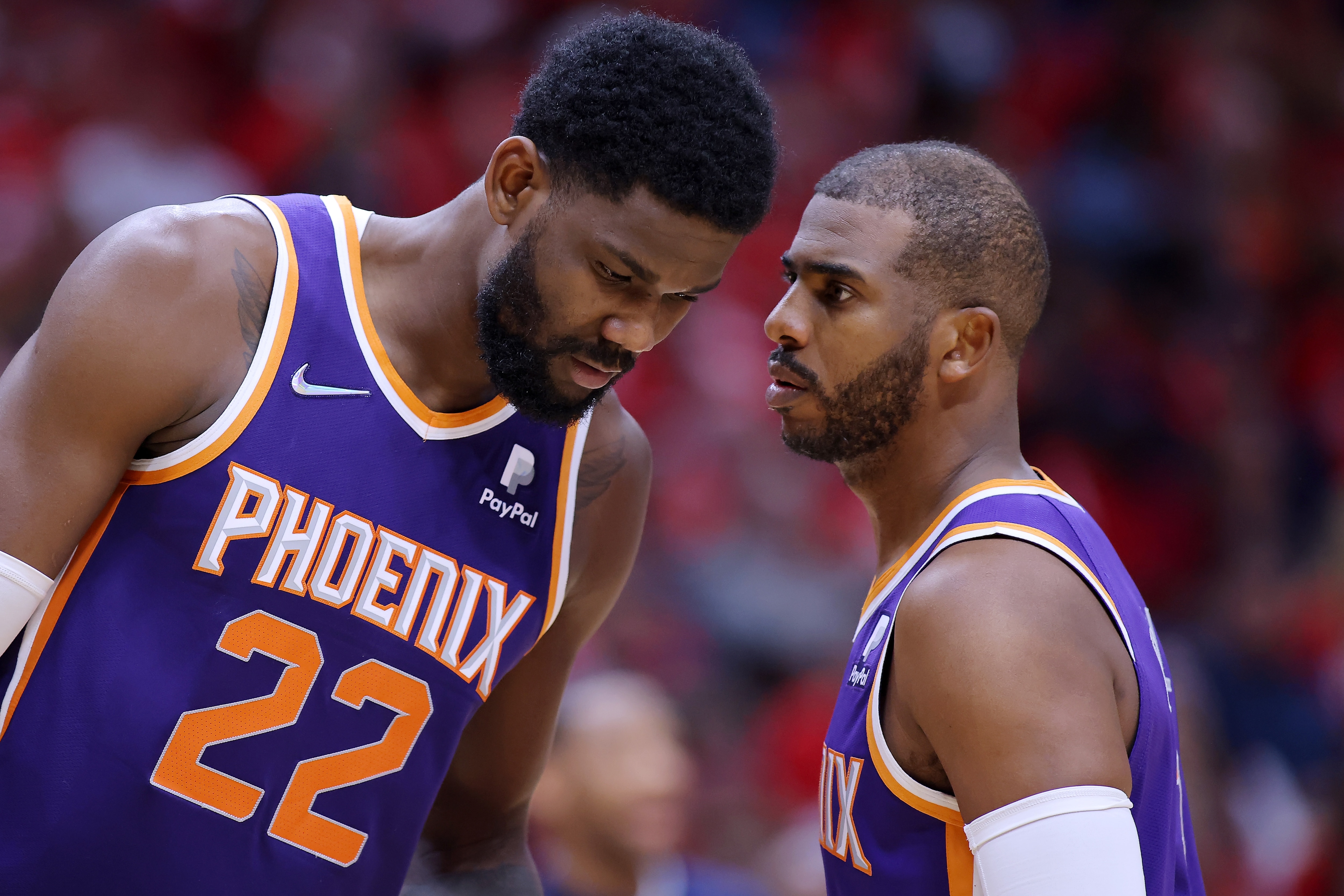 NEW ORLEANS, LOUISIANA - APRIL 24: Chris Paul #3 and Deandre Ayton #22 of the Phoenix Suns talk against the New Orleans Pelicans during Game Four of the Western Conference First Round NBA Playoffs at the Smoothie King Center on April 24, 2022 in New Orleans, Louisiana. NOTE TO USER: User expressly acknowledges and agrees that, by downloading and or using this Photograph, user is consenting to the terms and conditions of the Getty Images License Agreement. (Photo by Jonathan Bachman/Getty Images)