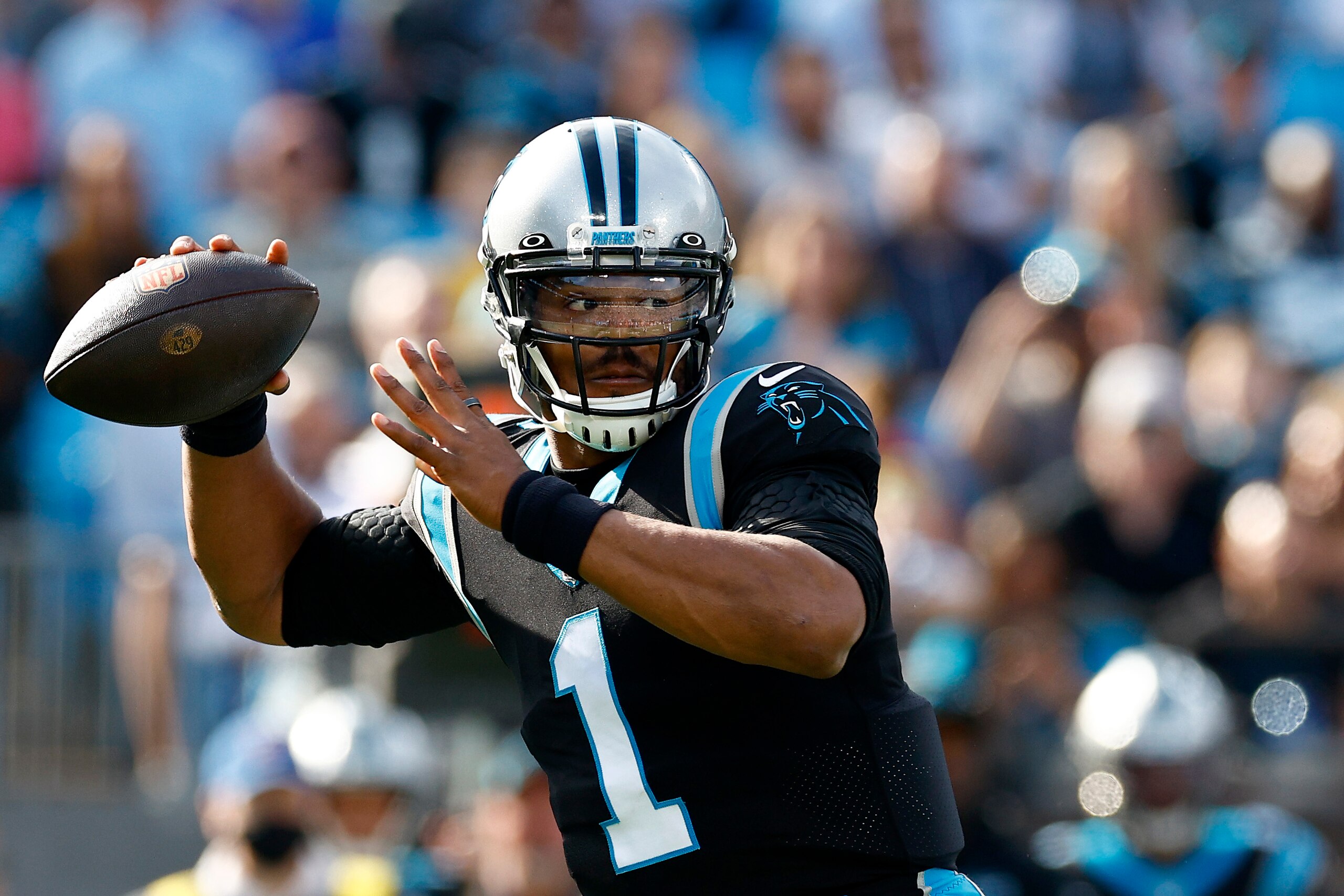CHARLOTTE, NORTH CAROLINA - DECEMBER 26: Cam Newton #1 of the Carolina Panthers looks to pass during the first half of the game against the Tampa Bay Buccaneers at Bank of America Stadium on December 26, 2021 in Charlotte, North Carolina. (Photo by Jared C. Tilton/Getty Images) CHARLOTTE, NORTH CAROLINA - DECEMBER 26: Cam Newton #1 of the Carolina Panthers looks to pass during the first half of the game against the Tampa Bay Buccaneers at Bank of America Stadium on December 26, 2021 in Charlotte, North Carolina. (Photo by Jared C. Tilton/Getty Images)