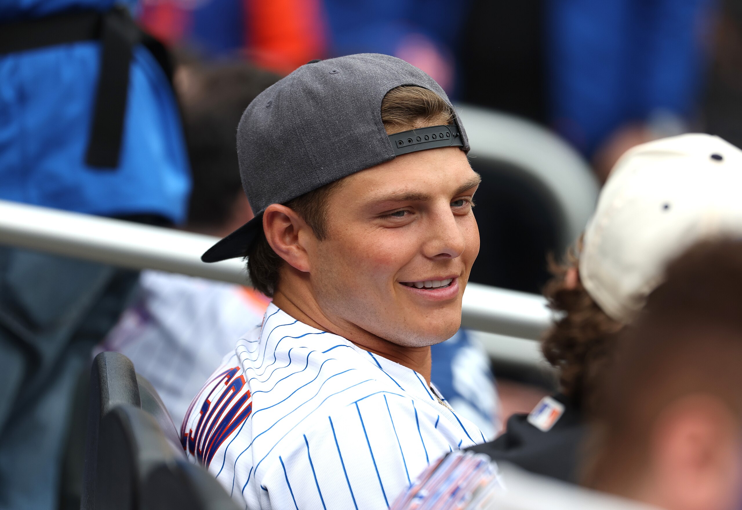 NEW YORK, NEW YORK - MAY 19:  Zach Wilson, Quarterback for the New York Jets watches the game between the New York Mets against the St. Louis Cardinals during their game at Citi Field on May 19, 2022 in New York City. (Photo by Al Bello/Getty Images)