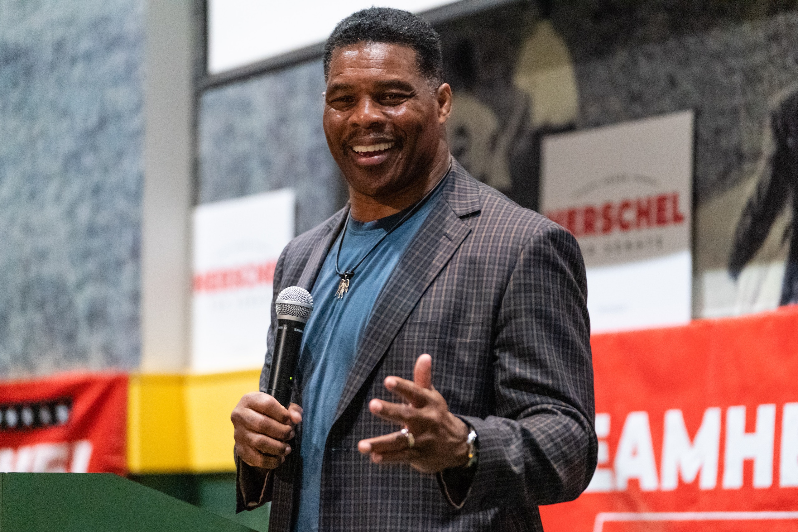 Herschel Walker, US Republican Senate candidate for Georgia, speaks during a campaign rally in Macon, Georgia, US, on Wednesday, May 18, 2022. Heisman Trophy-winner Walker is vying to face incumbent Democratic Senator Raphael Warnock in his first political run. Photographer: Elijah Nouvelage/Bloomberg via Getty Images