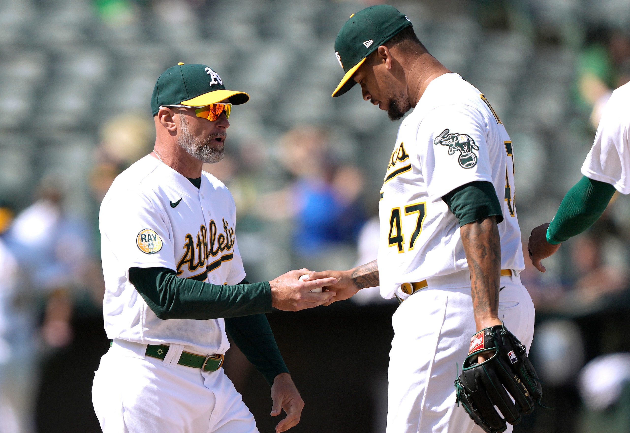 OAKLAND, CALIFORNIA - APRIL 23: Manager Mark Kotsay #7 of the Oakland Athletics takes the ball from Frankie Montas #47 taking him out of the game against the Texas Rangers in the top of the eighth inning at RingCentral Coliseum on April 23, 2022 in Oakland, California. (Photo by Thearon W. Henderson/Getty Images) OAKLAND, CALIFORNIA - APRIL 23: Manager Mark Kotsay #7 of the Oakland Athletics takes the ball from Frankie Montas #47 taking him out of the game against the Texas Rangers in the top of the eighth inning at RingCentral Coliseum on April 23, 2022 in Oakland, California. (Photo by Thearon W. Henderson/Getty Images)