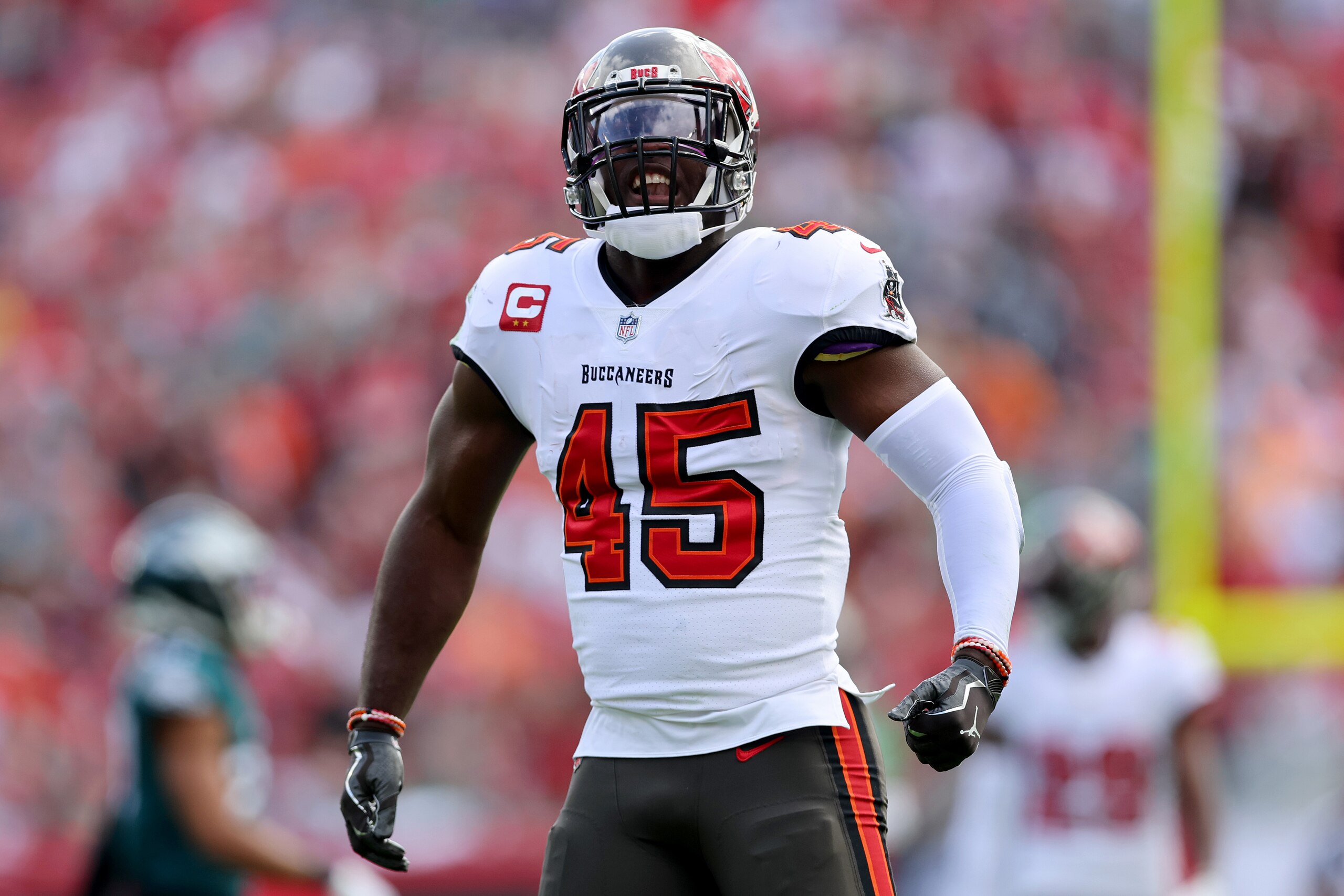 TAMPA, FLORIDA - JANUARY 16: Devin White #45 of the Tampa Bay Buccaneers celebrates a tackle against the Philadelphia Eagles during the first quarter in the NFC Wild Card Playoff game at Raymond James Stadium on January 16, 2022 in Tampa, Florida. (Photo by Michael Reaves/Getty Images)