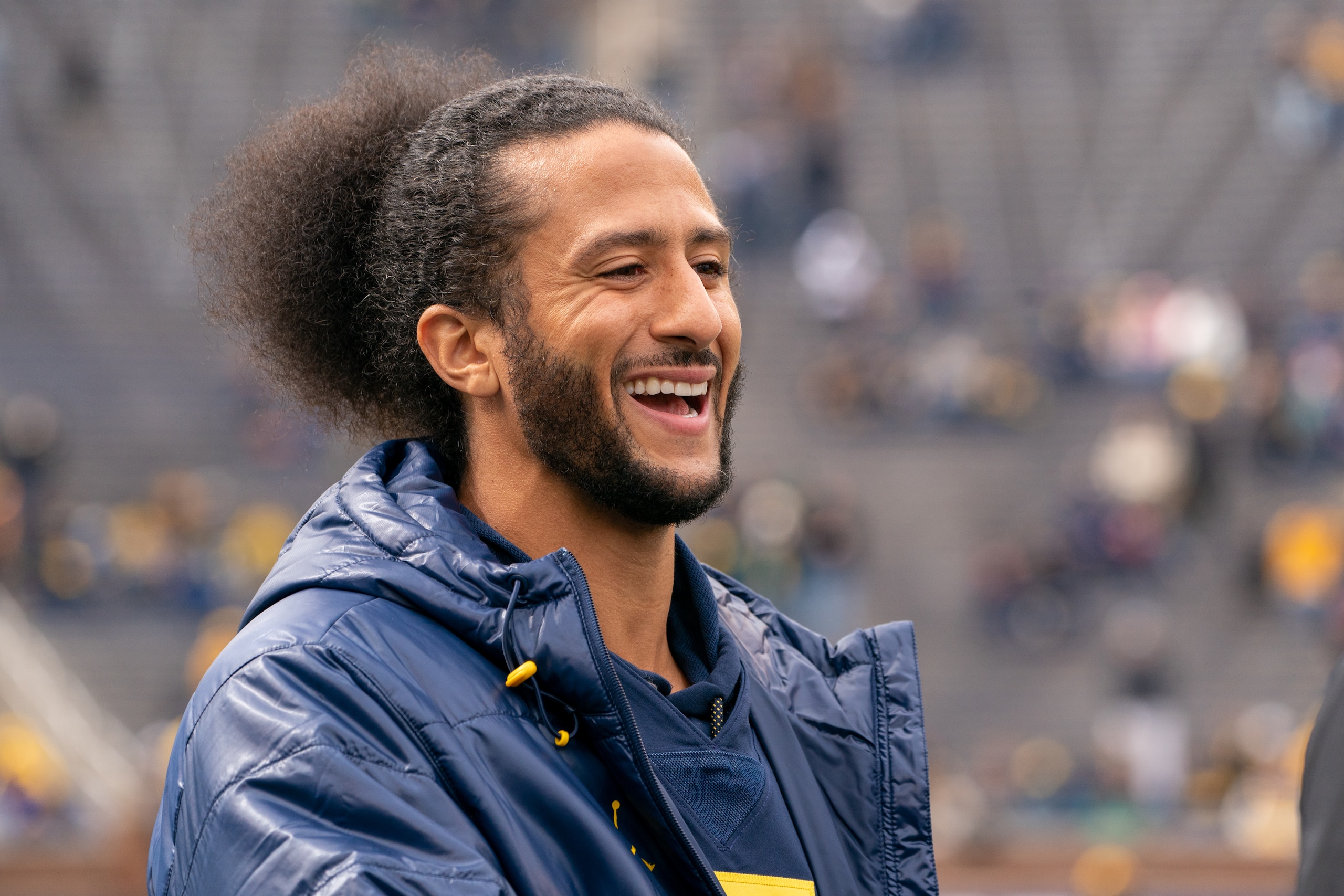 ANN ARBOR, MI - APRIL 02: Colin Kaepernick interacts with fans before the Michigan spring football game at Michigan Stadium on April 2, 2022 in Ann Arbor, Michigan.  Kaepernick was honorary captain for the game. (Photo by Jaime Crawford/Getty Images)