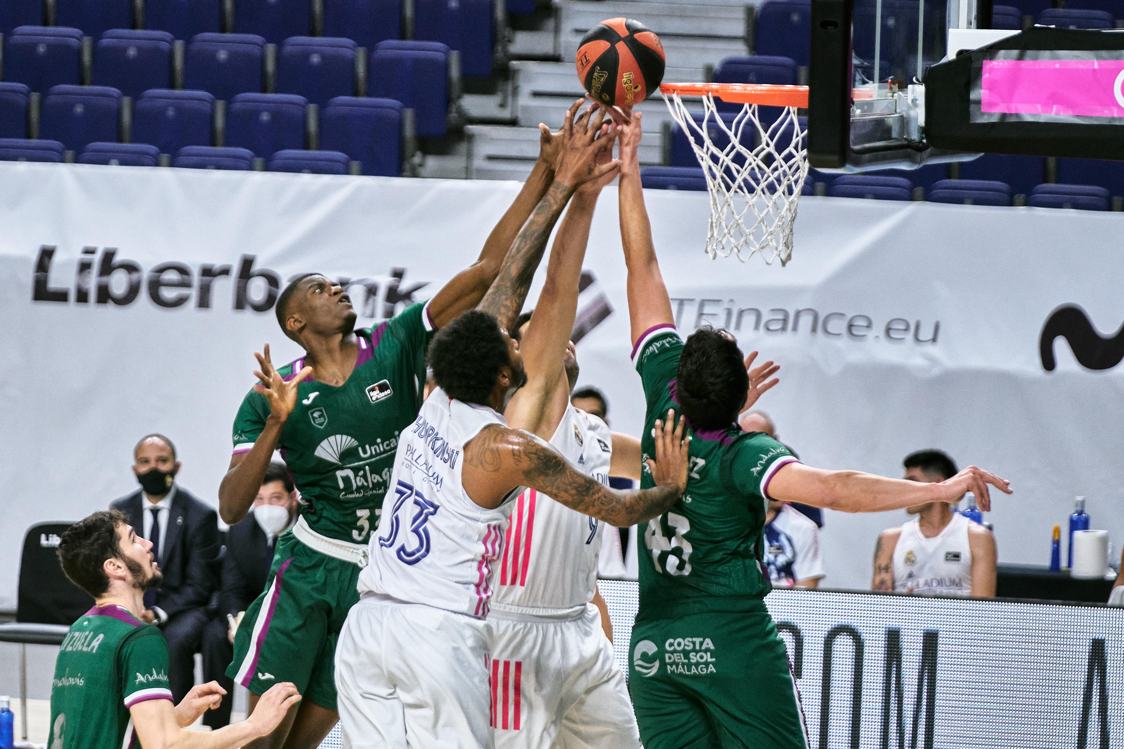 MADRID, SPAIN - DECEMBER 13: Yannick Nzosa of Unicaja and Carlos Suarez of Unicaja and Trey Thompkins of Real Madrid during the Liga ACB match between Real Madrid and Unicaja at Wizink Center on December 13, 2020 in Madrid, Spain. (Photo by Sonia Canada/Getty Images)