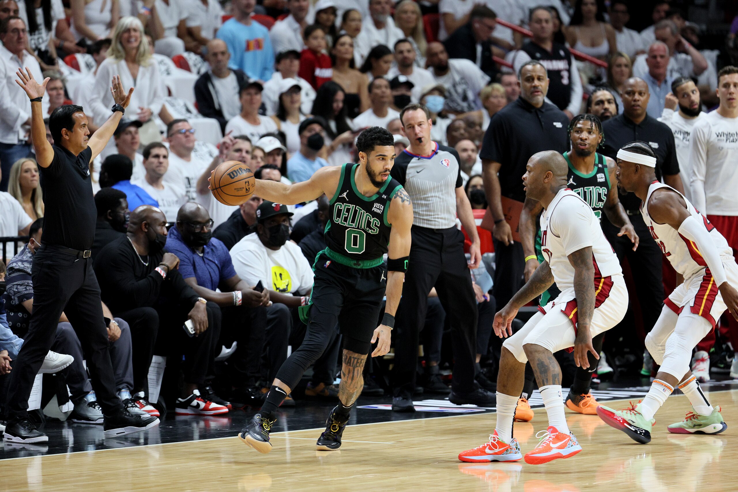 MIAMI, FLORIDA - MAY 25: Jayson Tatum #0 of the Boston Celtics drives to the ball against P.J. Tucker #17 and Jimmy Butler #22 of the Miami Heat during the first quarter in Game Five of the 2022 NBA Playoffs Eastern Conference Finals at FTX Arena on May 25, 2022 in Miami, Florida. NOTE TO USER: User expressly acknowledges and agrees that, by downloading and or using this photograph, User is consenting to the terms and conditions of the Getty Images License Agreement. (Photo by Andy Lyons/Getty Images)