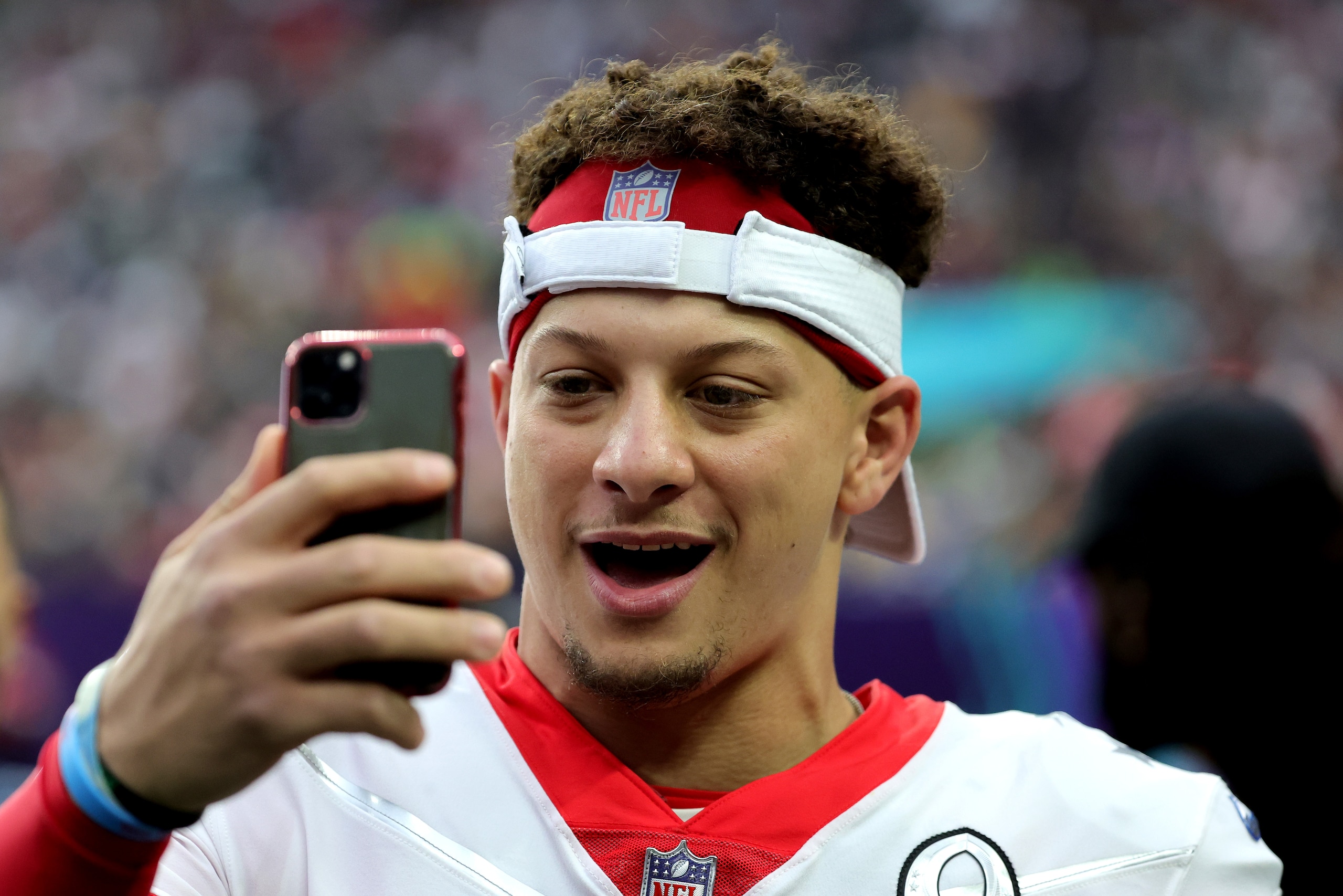 LAS VEGAS, NEVADA - FEBRUARY 06:  Patrick Mahomes #15 of the Kansas City Chiefs and AFC records a video message on a sideline during the 2022 NFL Pro Bowl against the NFC at Allegiant Stadium on February 06, 2022 in Las Vegas, Nevada. The AFC defeated the NFC 41-35.  (Photo by Ethan Miller/Getty Images)