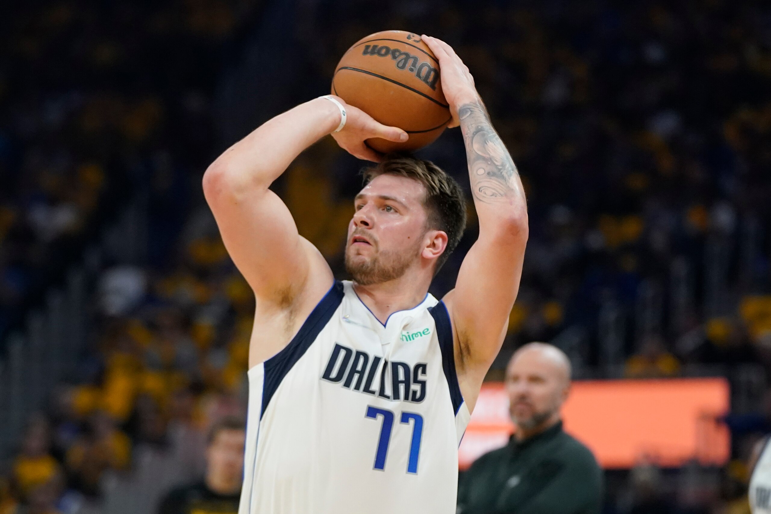 Dallas Mavericks guard Luka Doncic (77) shoots during the first half in Game 5 of the NBA basketball playoffs Western Conference finals against the Golden State Warriors in San Francisco, Thursday, May 26, 2022. (AP Photo/Jeff Chiu)