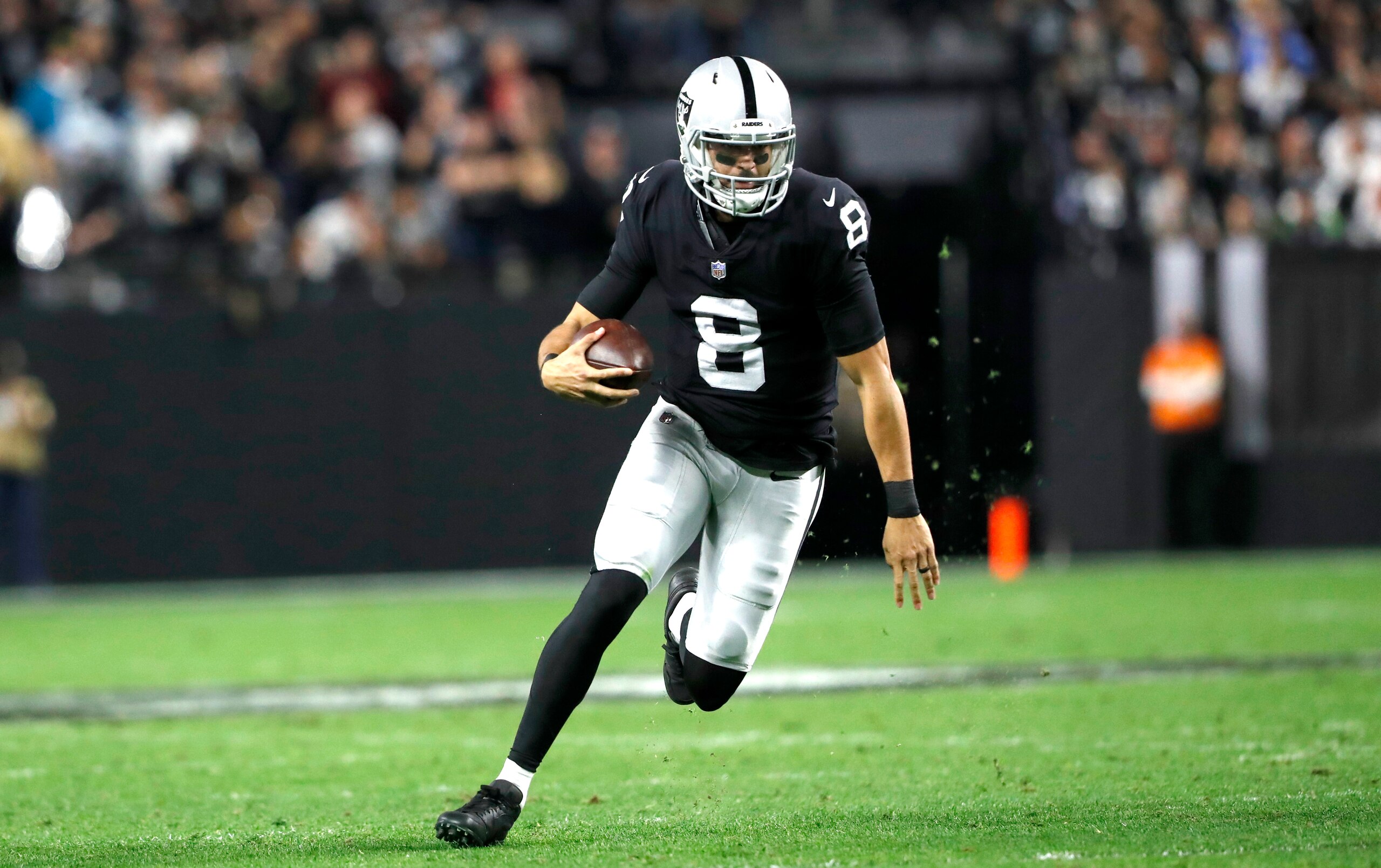 LAS VEGAS, NEVADA - JANUARY 09: Quarterback Marcus Mariota #8 of the Las Vegas Raiders runs with the ball during a game against the Los Angeles Chargers at Allegiant Stadium on January 09, 2022 in Las Vegas, Nevada. (Photo by Steve Marcus/Getty Images)