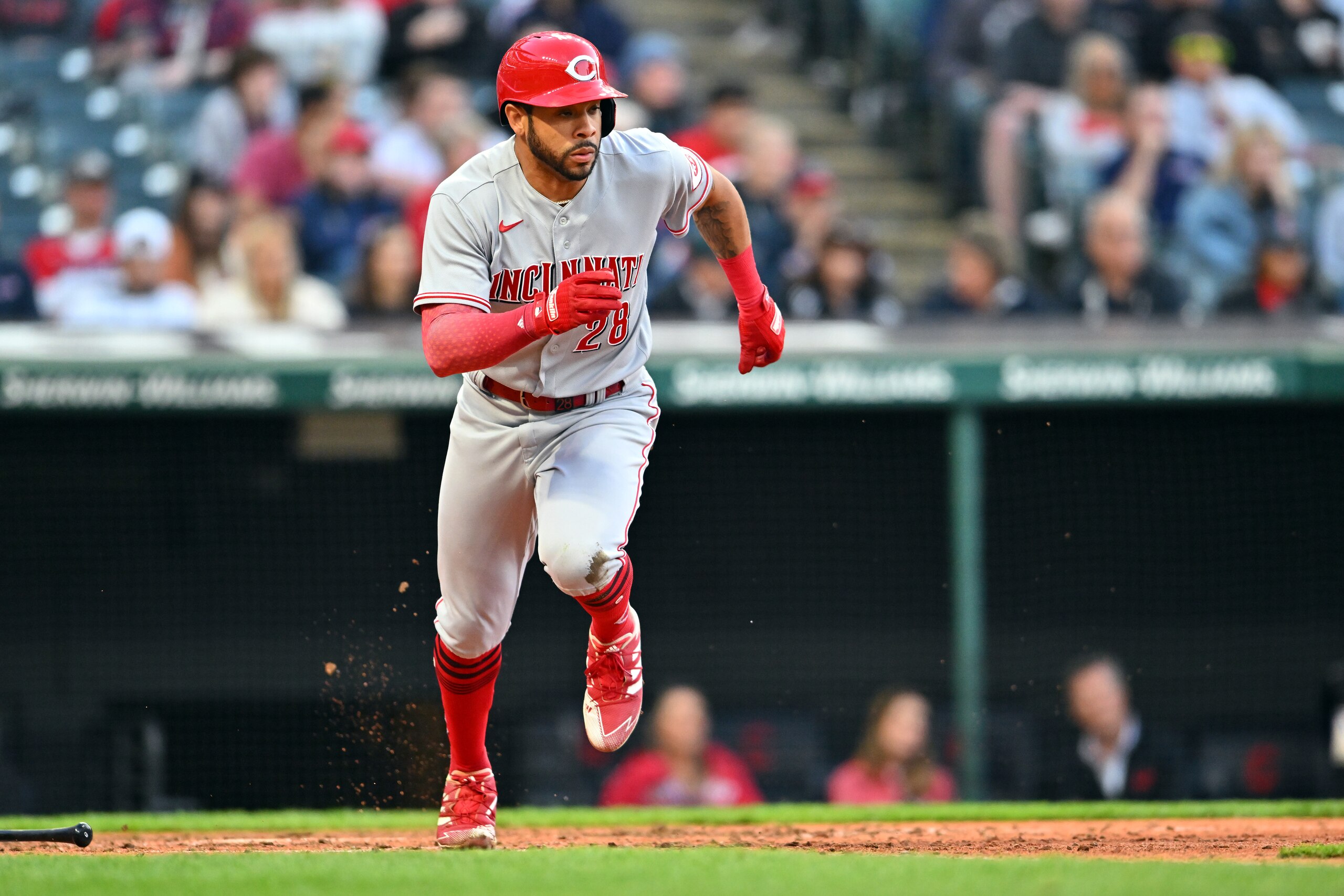 CLEVELAND, OHIO - MAY 17: Tommy Pham #28 of the Cincinnati Reds runs out an RBI single during the eighth inning against the Cleveland Guardians at Progressive Field on May 17, 2022 in Cleveland, Ohio. (Photo by Jason Miller/Getty Images)
