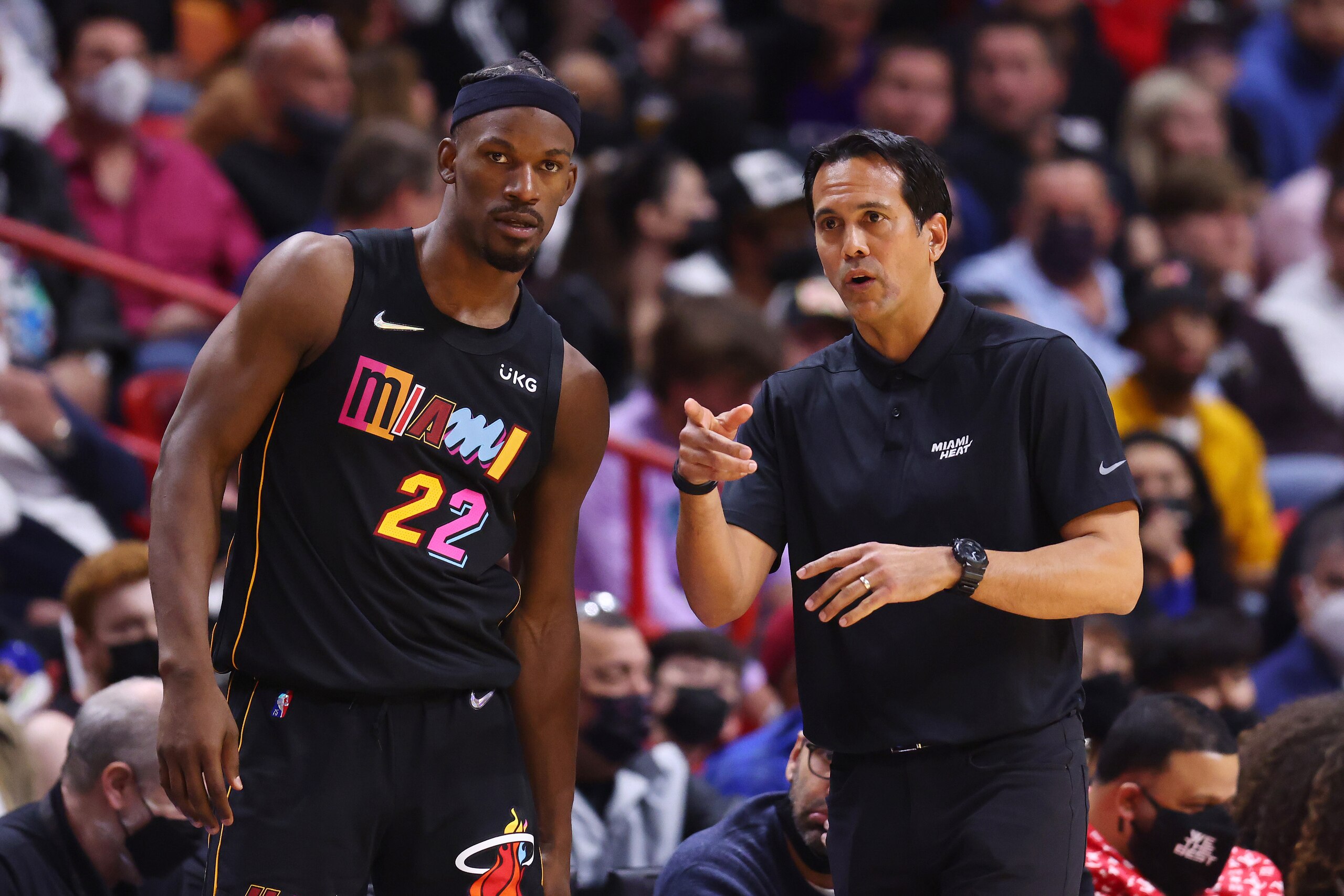 MIAMI, FLORIDA - JANUARY 23: Jimmy Butler #22 of the Miami Heat talks with head coach Erik Spoelstra against the Los Angeles Lakers during the first half at FTX Arena on January 23, 2022 in Miami, Florida. NOTE TO USER: User expressly acknowledges and agrees that, by downloading and or using this photograph, User is consenting to the terms and conditions of the Getty Images License Agreement.  (Photo by Michael Reaves/Getty Images)