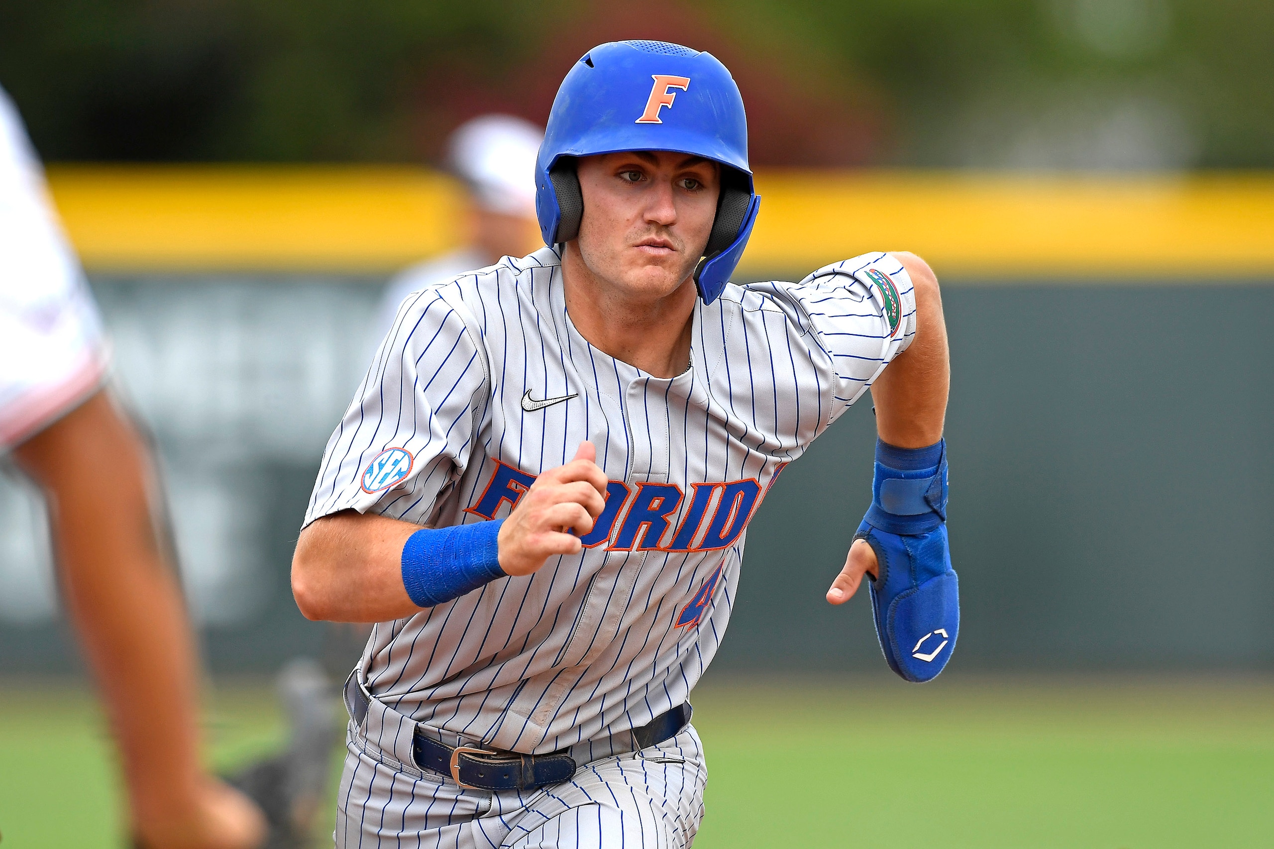 CORAL GABLES, FL - MARCH 06: Florida outfielder Jud Fabian (4) runs to third base in the sixth inning as the University of Miami Hurricanes faced the University of Florida Gators on March 6, 2022, at Mark Light Field at Alex Rodriguez Park in Coral Gables, Florida. (Photo by Samuel Lewis/Icon Sportswire via Getty Images)