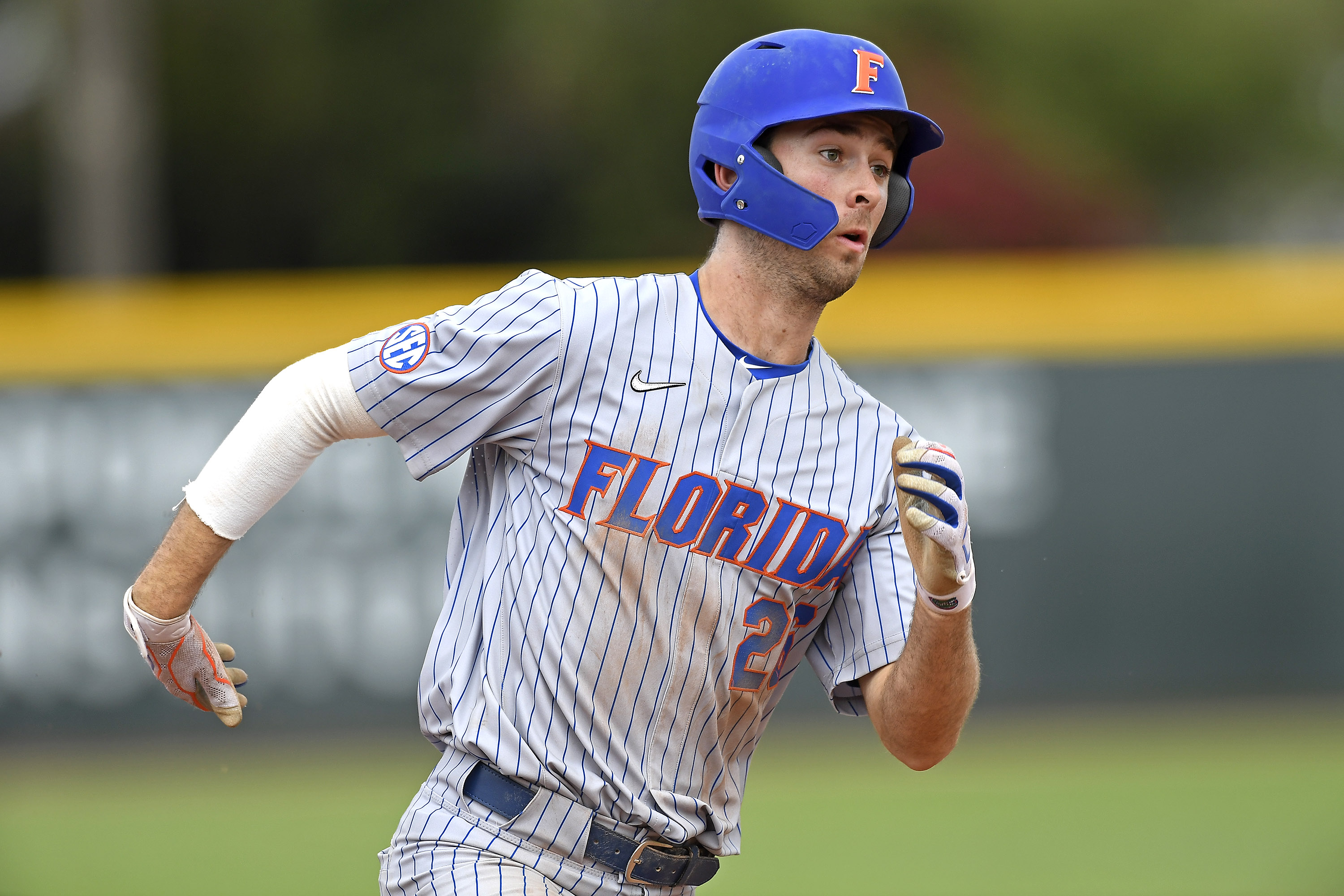 CORAL GABLES, FL - MARCH 06: Florida outfielder/infielder Sterlin Thompson (26) runs to third base in the sixth inning as the University of Miami Hurricanes faced the University of Florida Gators on March 6, 2022, at Mark Light Field at Alex Rodriguez Park in Coral Gables, Florida. (Photo by Samuel Lewis/Icon Sportswire via Getty Images)