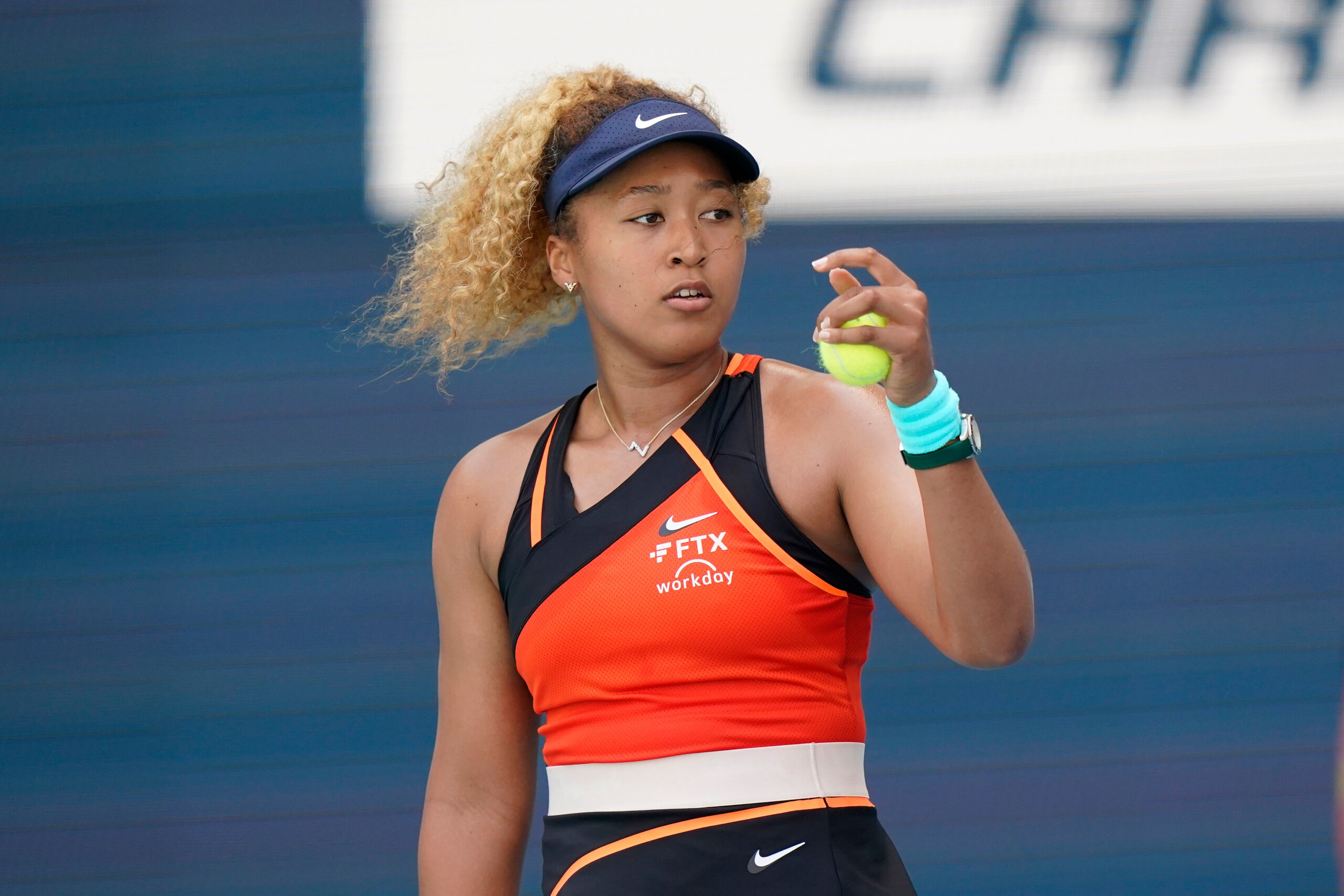 Naomi Osaka of Japan prepares to serve to Iga Swiatek of Poland, during the women's singles finals of the Miami Open tennis tournament, Saturday, April 2, 2022, in Miami Gardens, Fla. (AP Photo/Wilfredo Lee)