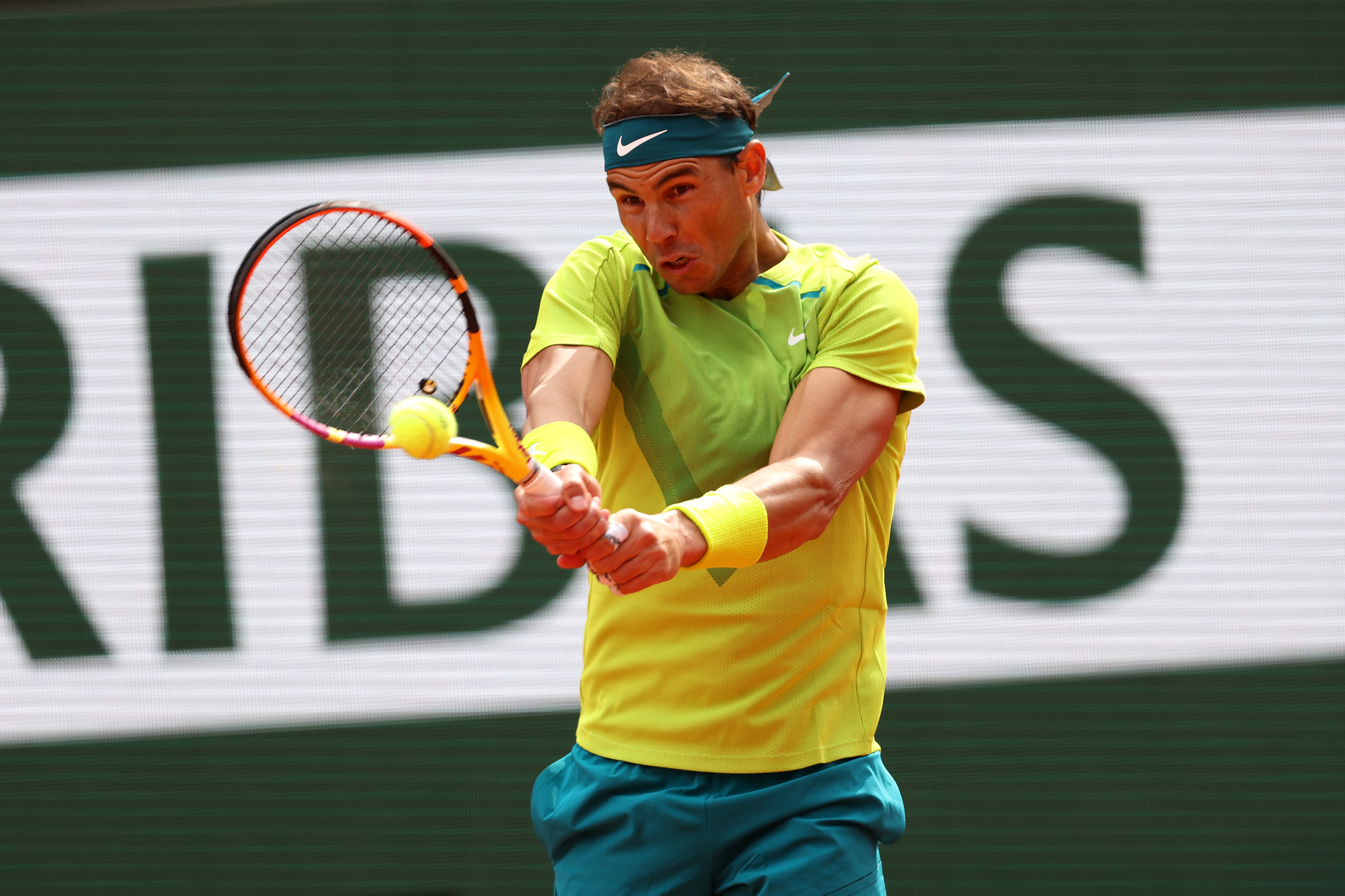 PARIS, FRANCE - MAY 29: Rafael Nadal of Spain plays a backhand Felix Auger-Aliassime of Canada during the Men's Singles Fourth Round match on Day 8 of The 2022 French Open at Roland Garros on May 29, 2022 in Paris, France. (Photo by Clive Brunskill/Getty Images)