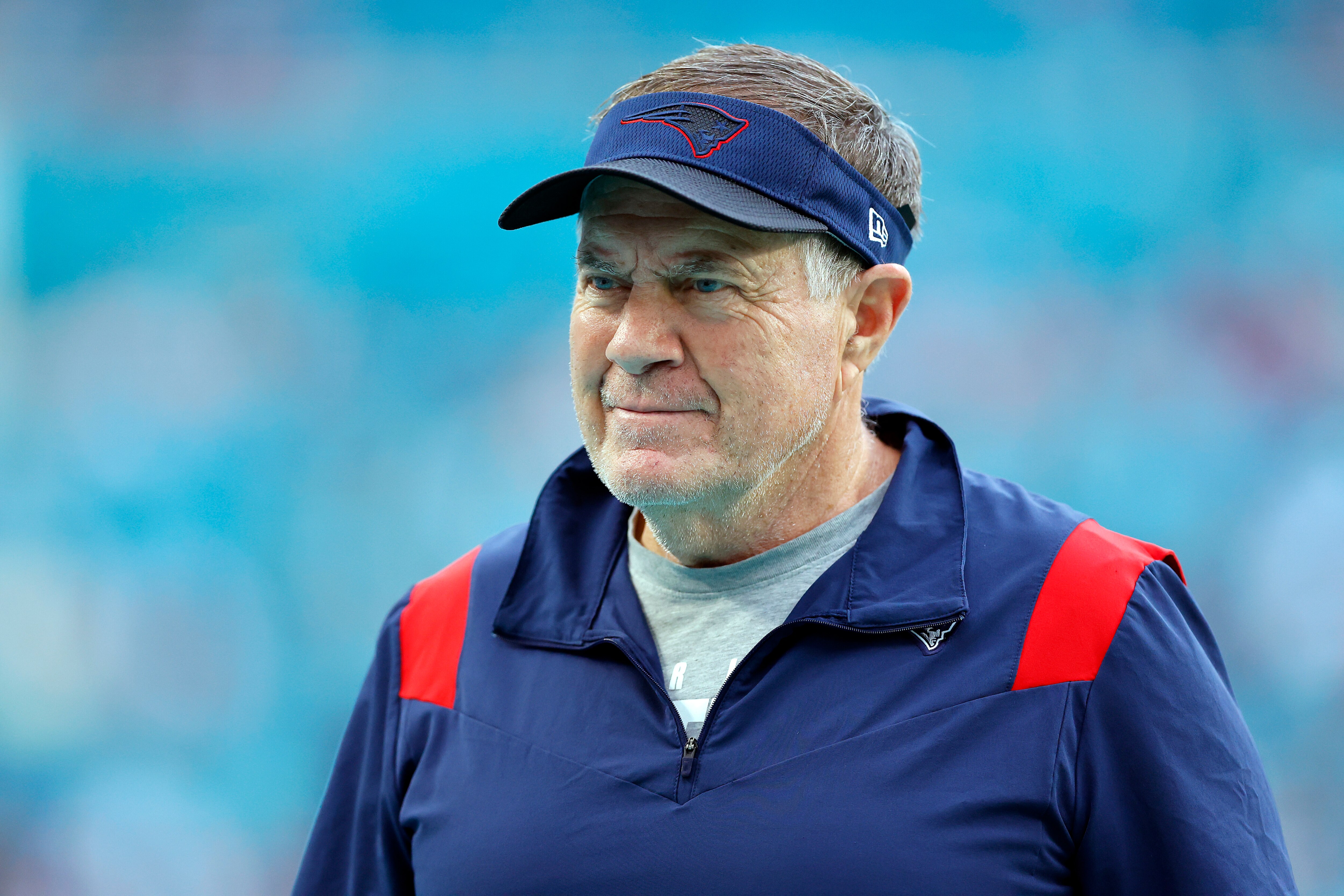 MIAMI GARDENS, FLORIDA - JANUARY 09: Head coach Bill Belichick of the New England Patriots  looks on during warm ups prior to the game against the Miami Dolphins at Hard Rock Stadium on January 09, 2022 in Miami Gardens, Florida. (Photo by Michael Reaves/Getty Images)