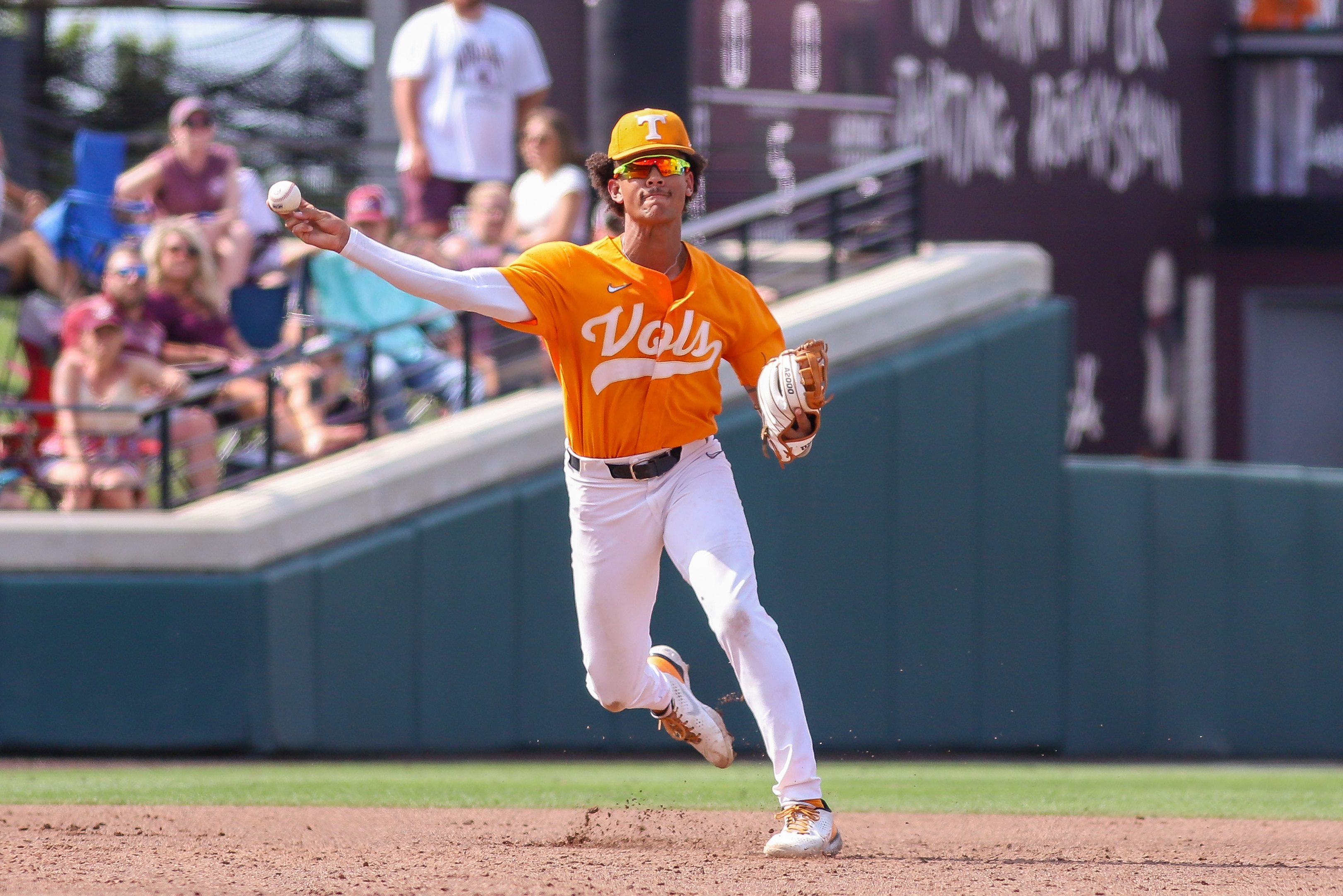 STARKVILLE, MS - MAY 21: Tennessee Volunteers infielder Trey Lipscomb (21) throws to first base during the game between the Mississippi State Bulldogs and the Tennessee Volunteers on May 21, 2022 at Dudy Noble Field at Polk-DeMent Stadium in Starkville, MS. (Photo by Chris McDill/Icon Sportswire via Getty Images)