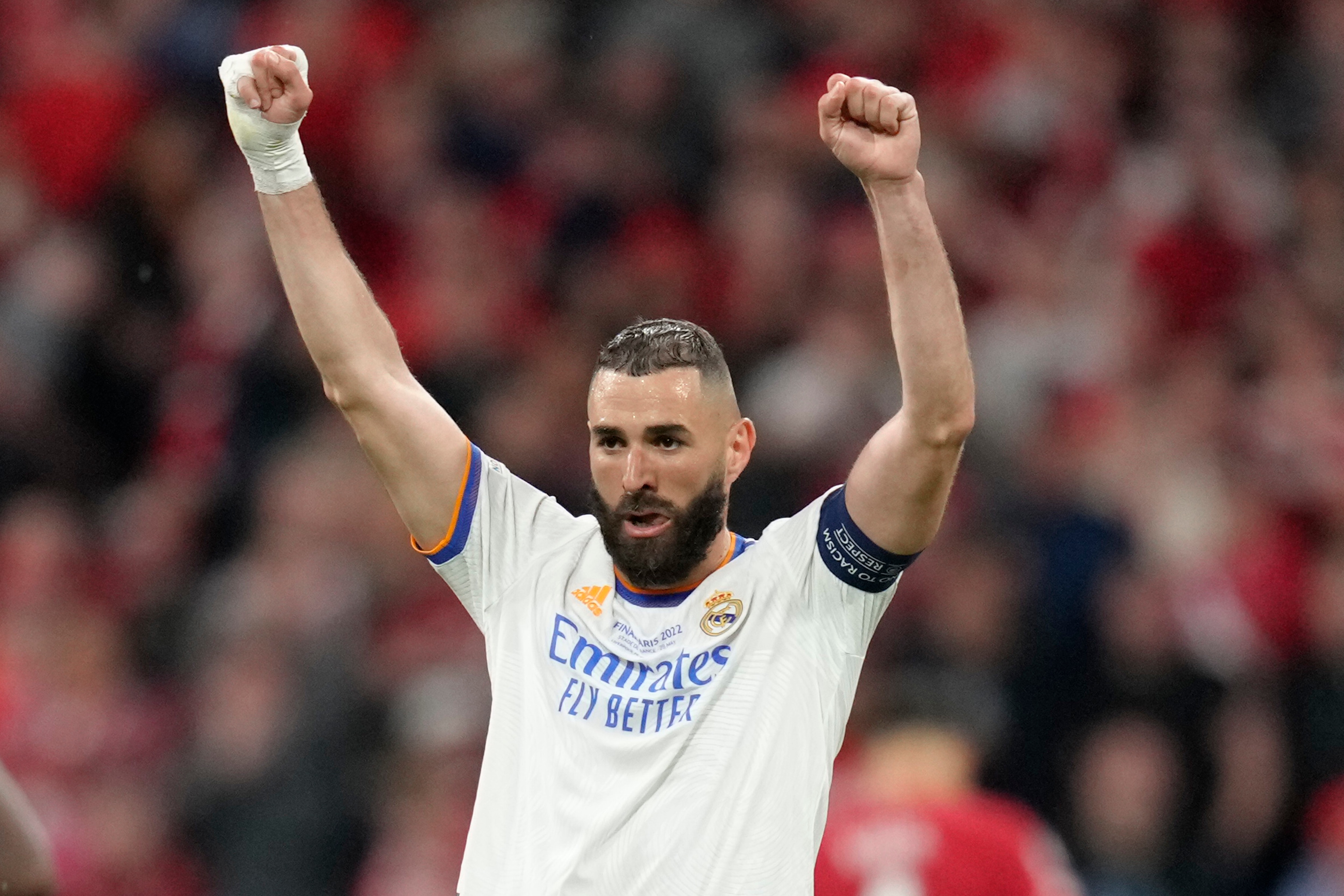 Real Madrid's Karim Benzema celebrates winning the Champions League final soccer match between Liverpool and Real Madrid at the Stade de France in Saint Denis near Paris, Saturday, May 28, 2022. Real Madrid won 1-0. (AP Photo/Kirsty Wigglesworth)