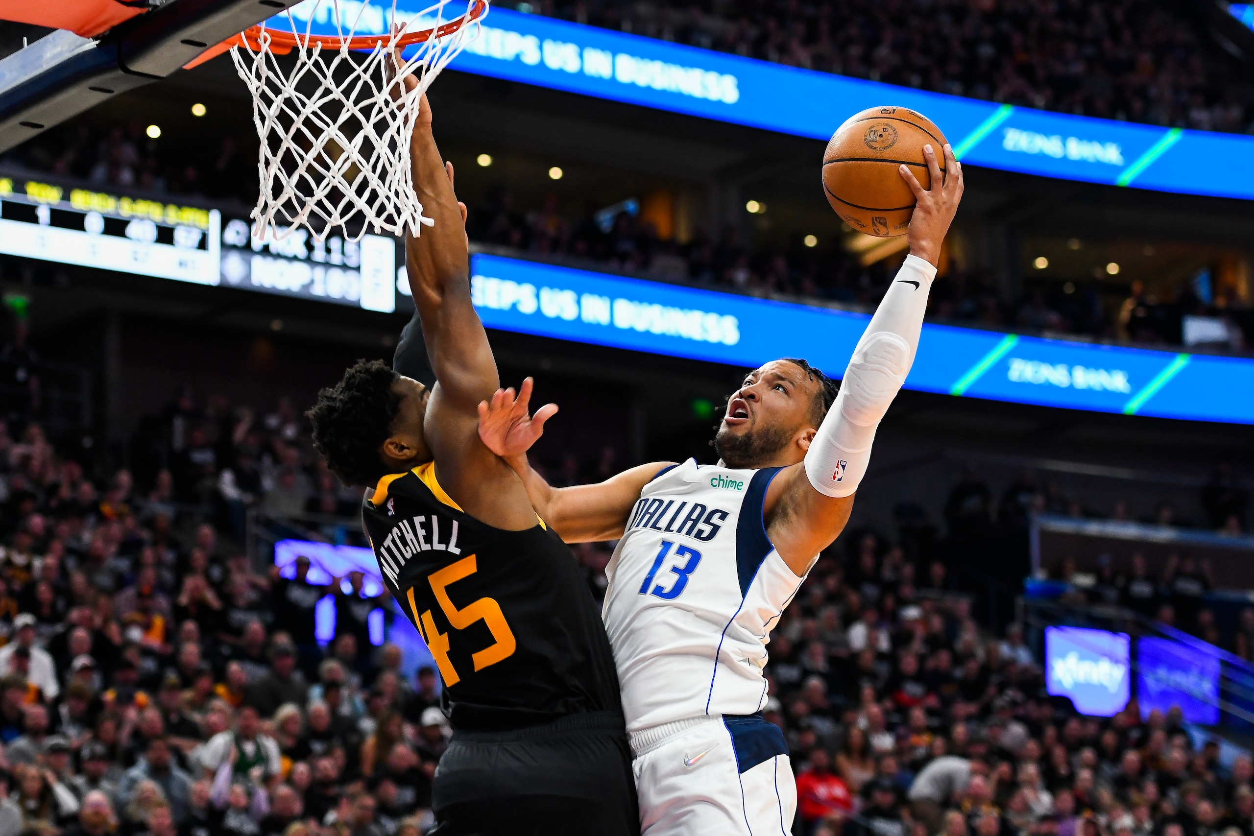 SALT LAKE CITY, UTAH - APRIL 28: Jalen Brunson #13 of the Dallas Mavericks goes up for a shot against Donovan Mitchell #45 of the Utah Jazz during the first half of Game 6 of the Western Conference First Round Playoffs at Vivint Smart Home Arena on April 28, 2022 in Salt Lake City, Utah. NOTE TO USER: User expressly acknowledges and agrees that, by downloading and/or using this Photograph, user is consenting to the terms and conditions of the Getty Images License Agreement. (Photo by Alex Goodlett/Getty Images)