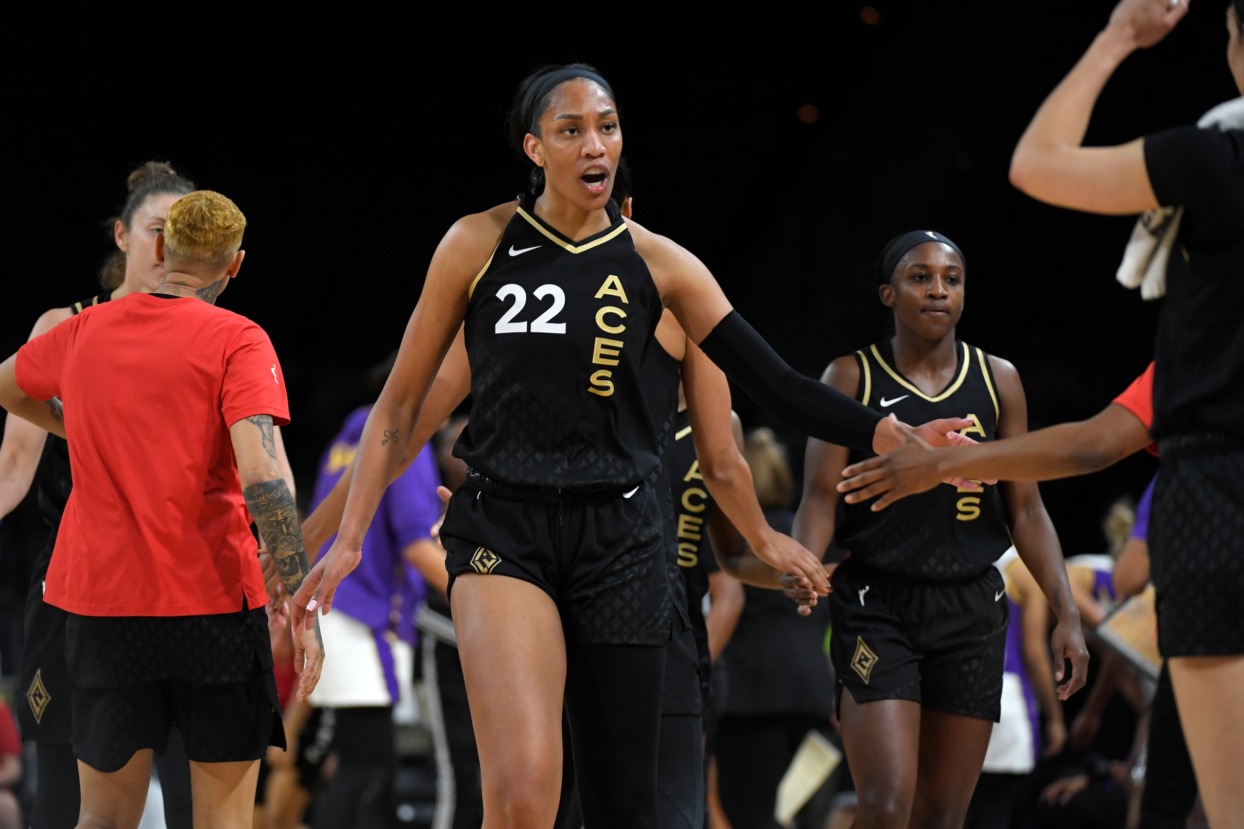 LAS VEGAS, NV - MAY 23: A'ja Wilson #22 of the Las Vegas Aces high fives a teammate during the game against the Los Angeles Sparks on May 23, 2022 at Michelob ULTRA Arena in Las Vegas, Nevada. NOTE TO USER: User expressly acknowledges and agrees that, by downloading and or using this Photograph, user is consenting to the terms and conditions of the Getty Images License Agreement. Mandatory Copyright Notice: Copyright 2022 NBAE (Photo by David Becker/NBAE via Getty Images)