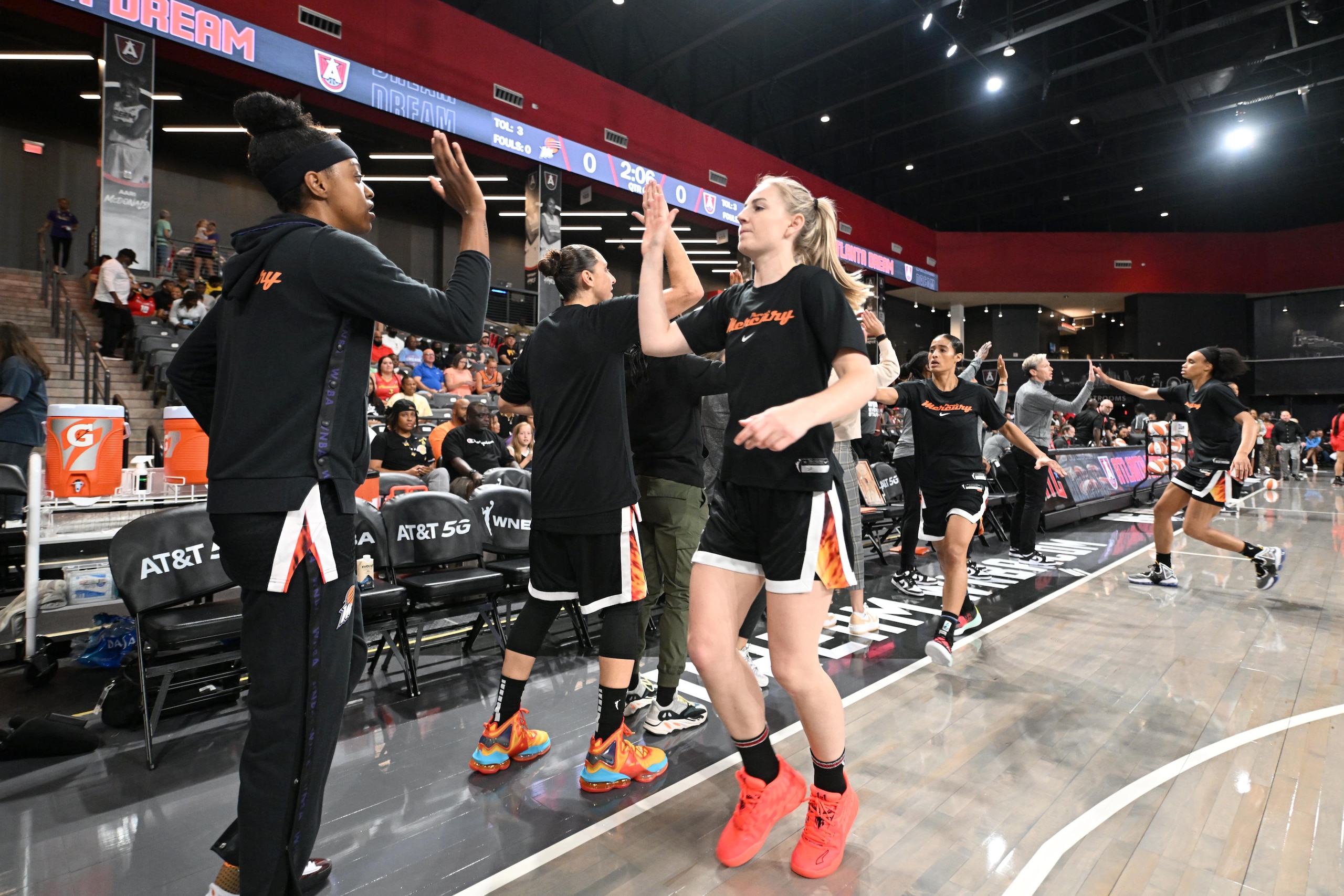 COLLEGE PARK, GA - MAY 29: Karlie Samuelson #44 of the Phoenix Mercury high fives her teammates before the game against the Atlanta Dream on May 29, 2022 at Gateway Center Arena in College Park, Georgia.  NOTE TO USER: User expressly acknowledges and agrees that, by downloading and/or using this Photograph, user is consenting to the terms and conditions of the Getty Images License Agreement. Mandatory Copyright Notice: Copyright 2022 NBAE (Photo by Adam Hagy/NBAE via Getty Images)