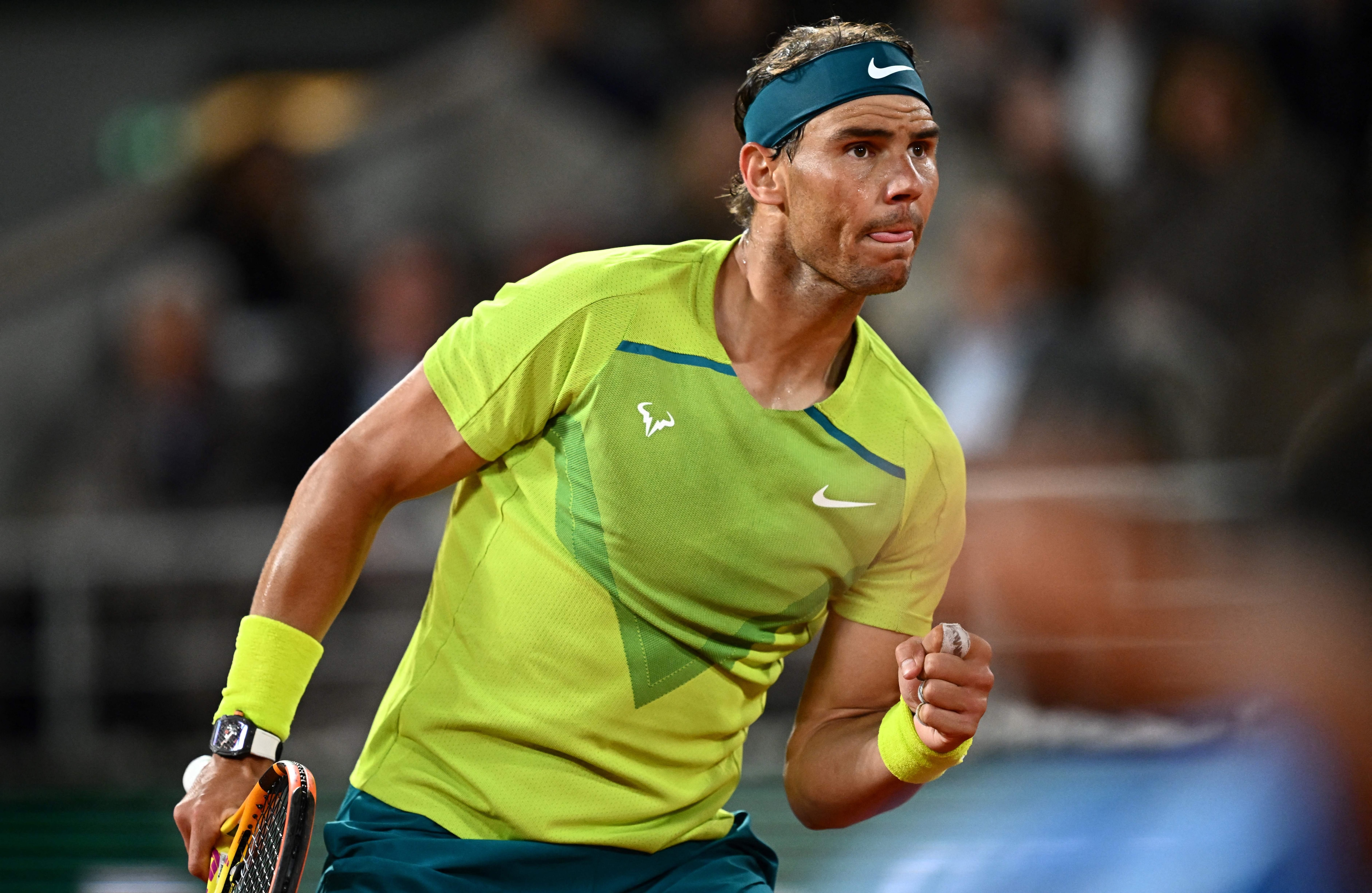 Spain's Rafael Nadal reacts after a point against Serbia's Novak Djokovic during their men's singles match on day ten of the Roland-Garros Open tennis tournament at the Court Philippe-Chatrier in Paris on May 31, 2022. (Photo by Anne-Christine POUJOULAT / AFP) (Photo by ANNE-CHRISTINE POUJOULAT/AFP via Getty Images)