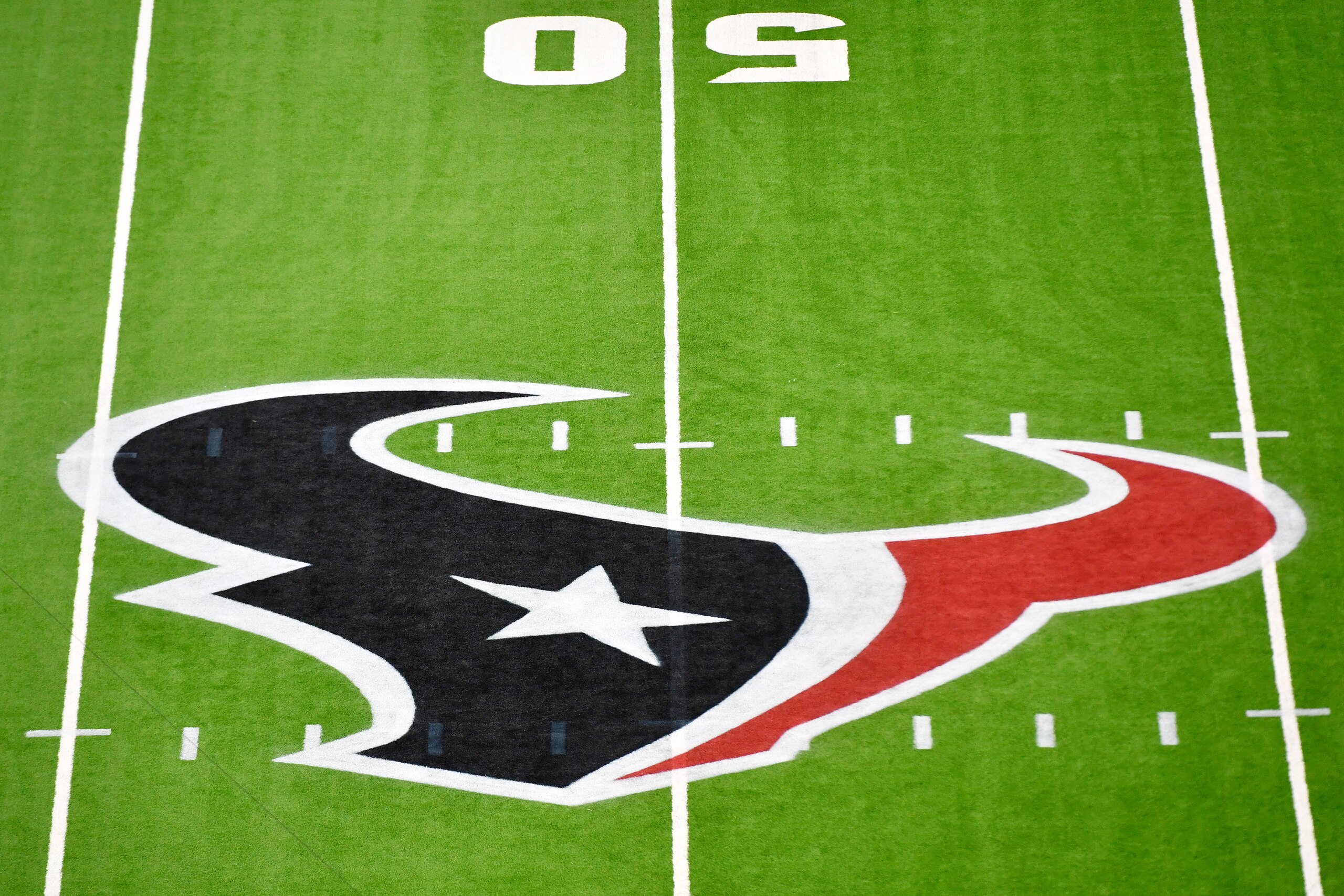 HOUSTON, TEXAS - OCTOBER 25: A detail view of the Houston Texans logo prior to the game between the Houston Texans and the Green Bay Packers at NRG Stadium on October 25, 2020 in Houston, Texas. (Photo by Logan Riely/Getty Images) HOUSTON, TEXAS - OCTOBER 25: A detail view of the Houston Texans logo prior to the game between the Houston Texans and the Green Bay Packers at NRG Stadium on October 25, 2020 in Houston, Texas. (Photo by Logan Riely/Getty Images)