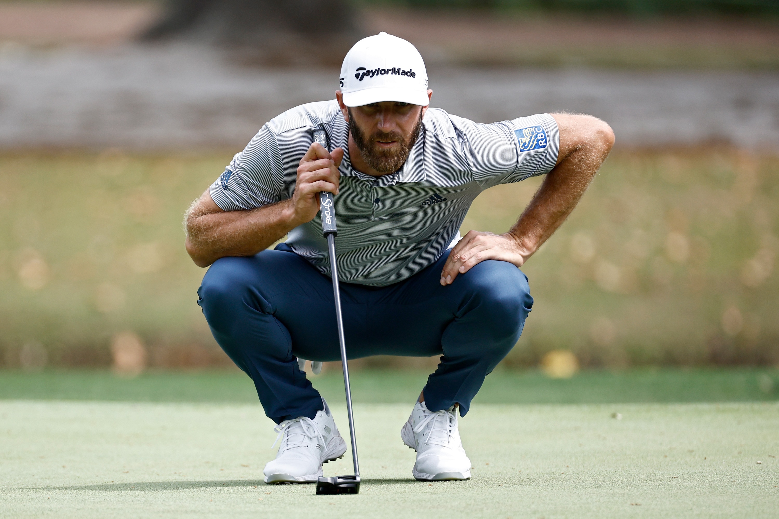 HILTON HEAD ISLAND, SOUTH CAROLINA - APRIL 14: Dustin Johnson lines up a putt on the seventh green during the first round of the RBC Heritage at Harbor Town Golf Links on April 14, 2022 in Hilton Head Island, South Carolina. (Photo by Jared C. Tilton/Getty Images)